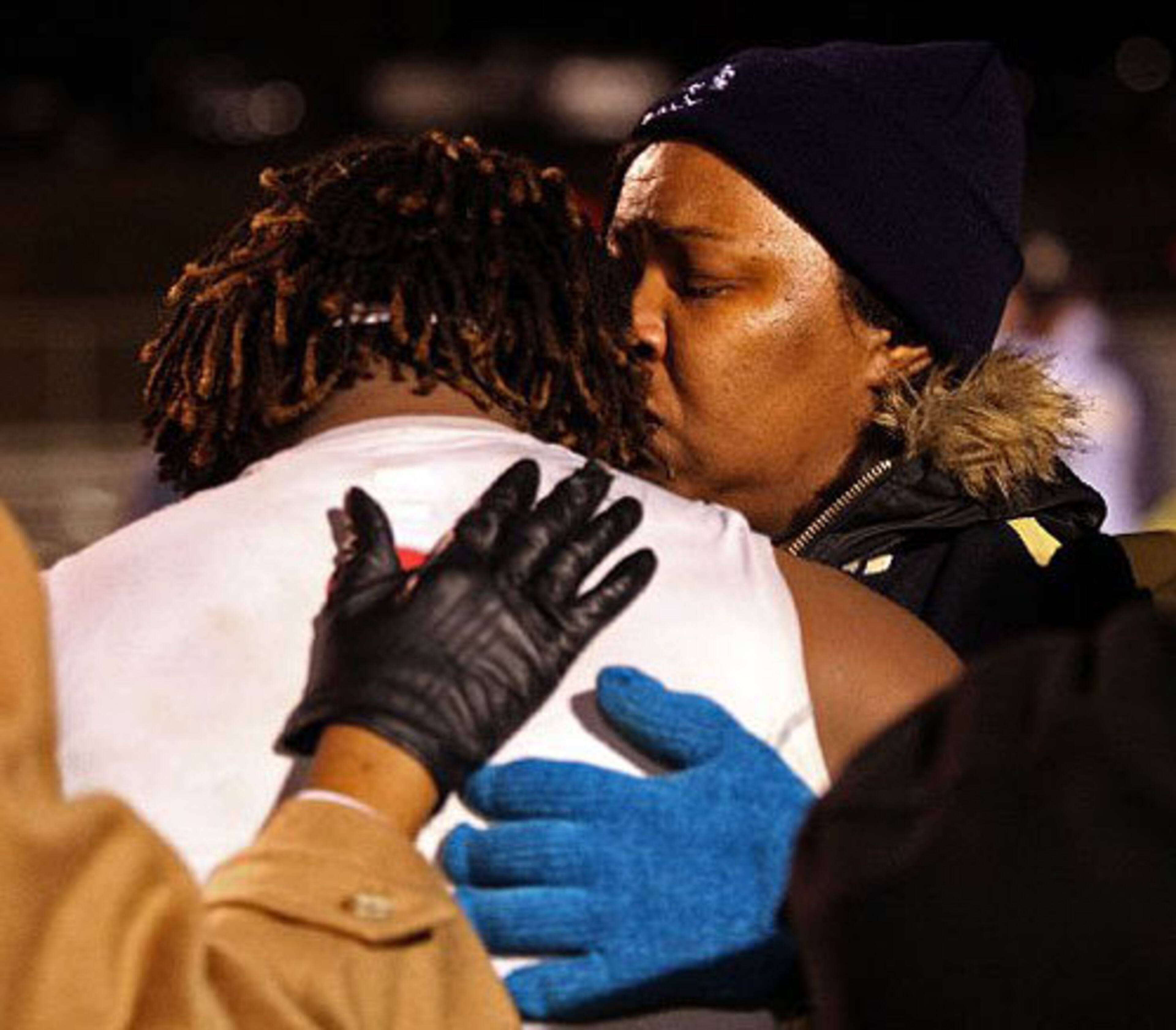Alexander Ogletree (33) is consoled by his mother Allyson Ogletree and other family.