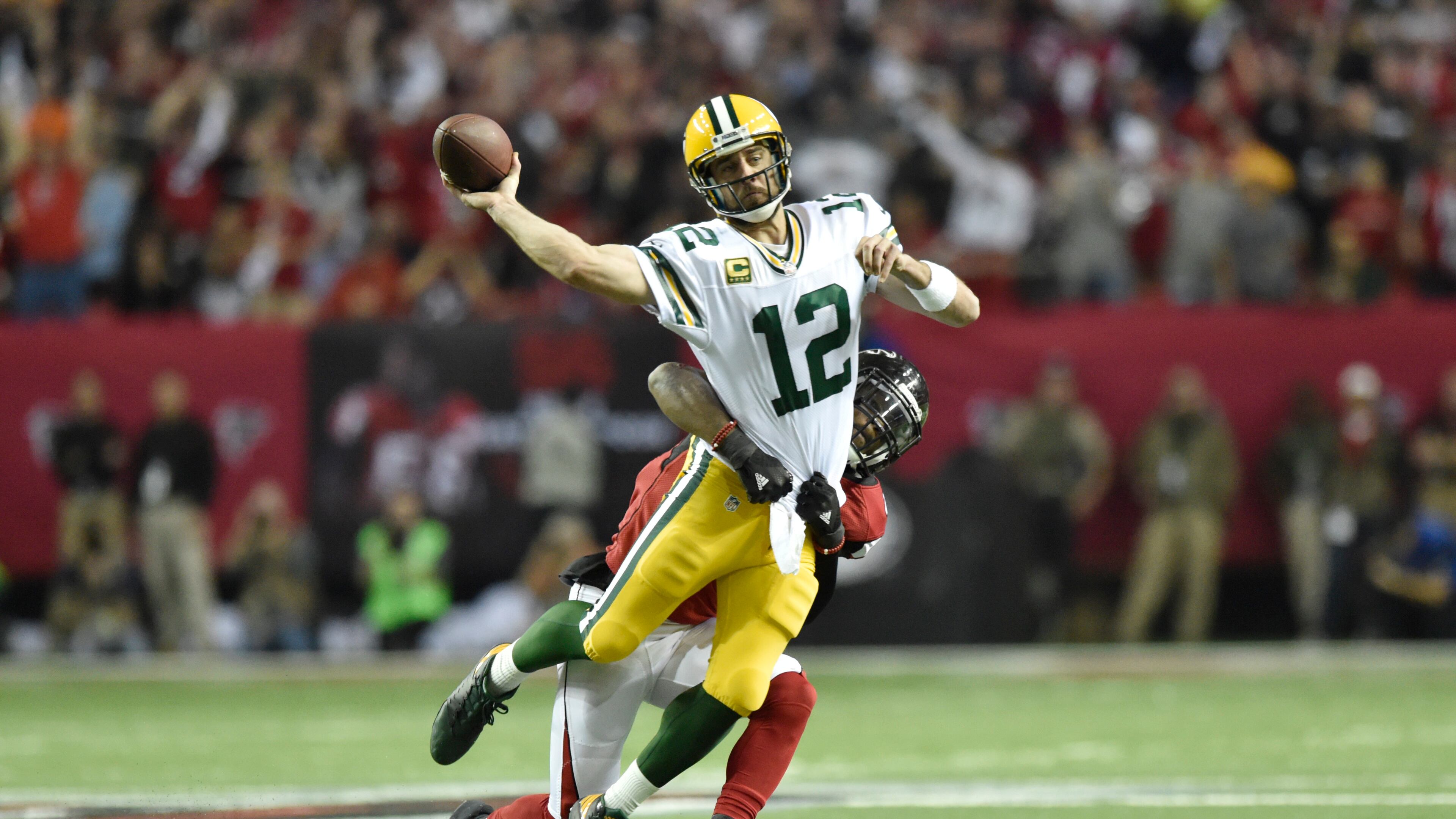 Packers quarterback Aaron Rodgers (12) is sacked during the NFC Championship game against the Packers in Atlanta, Georgia, on Sunday, January 22, 2017. (DAVID BARNES / DAVID.BARNES@AJC.COM)
