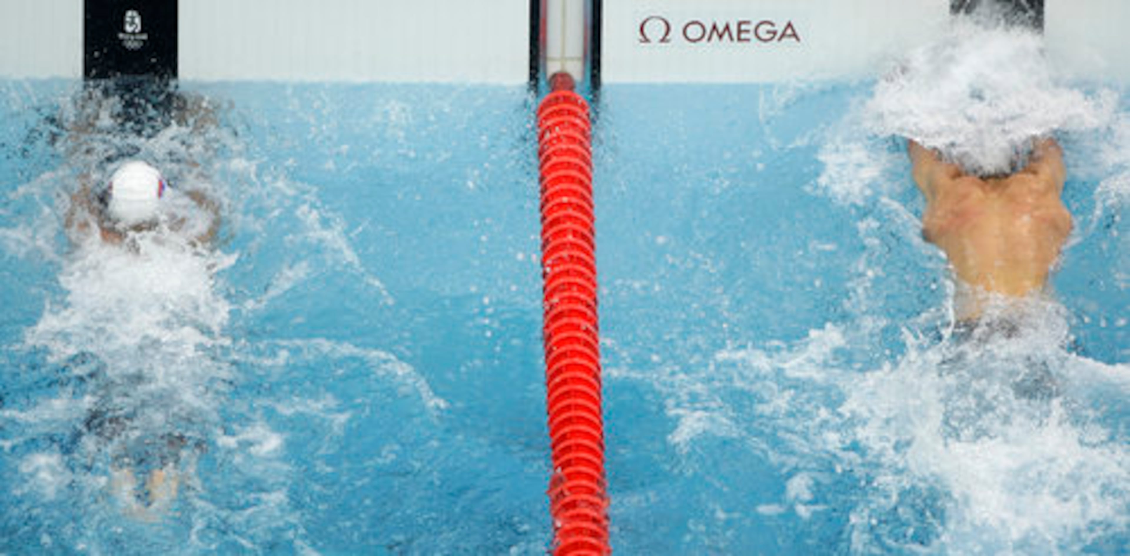 Phelps (right) beats Serbia's Milorad Cavic by 0.01 seconds to win the gold.