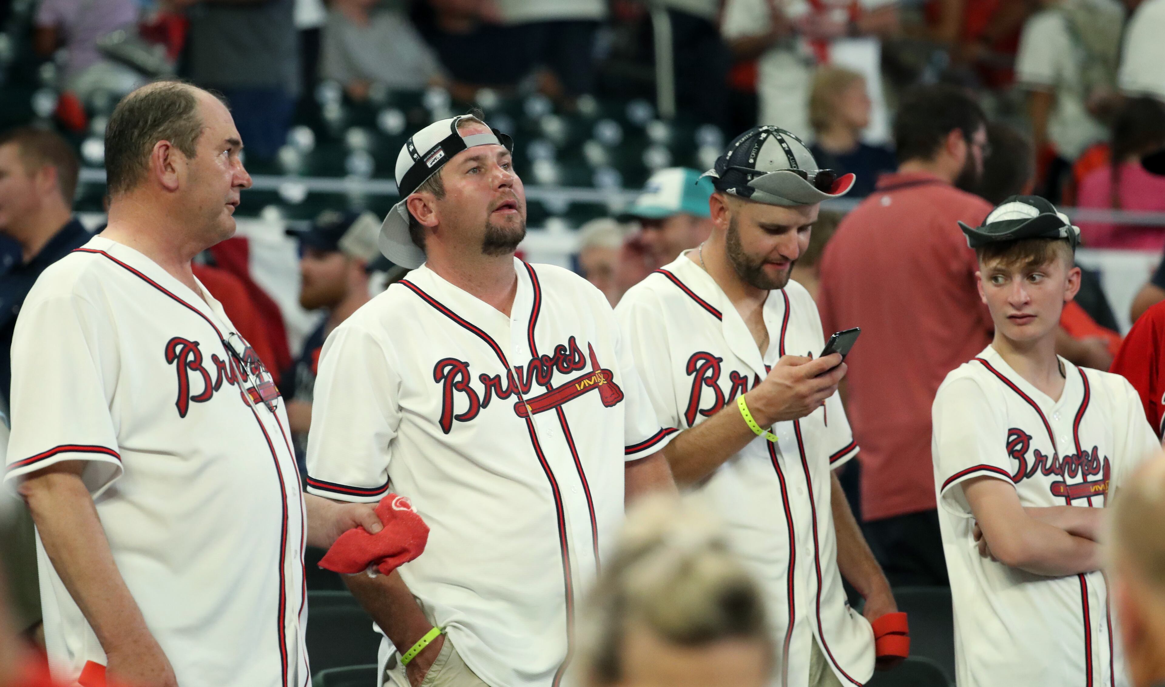 Braves fans react after the loss. (JASON GETZ/SPECIAL TO THE AJC)