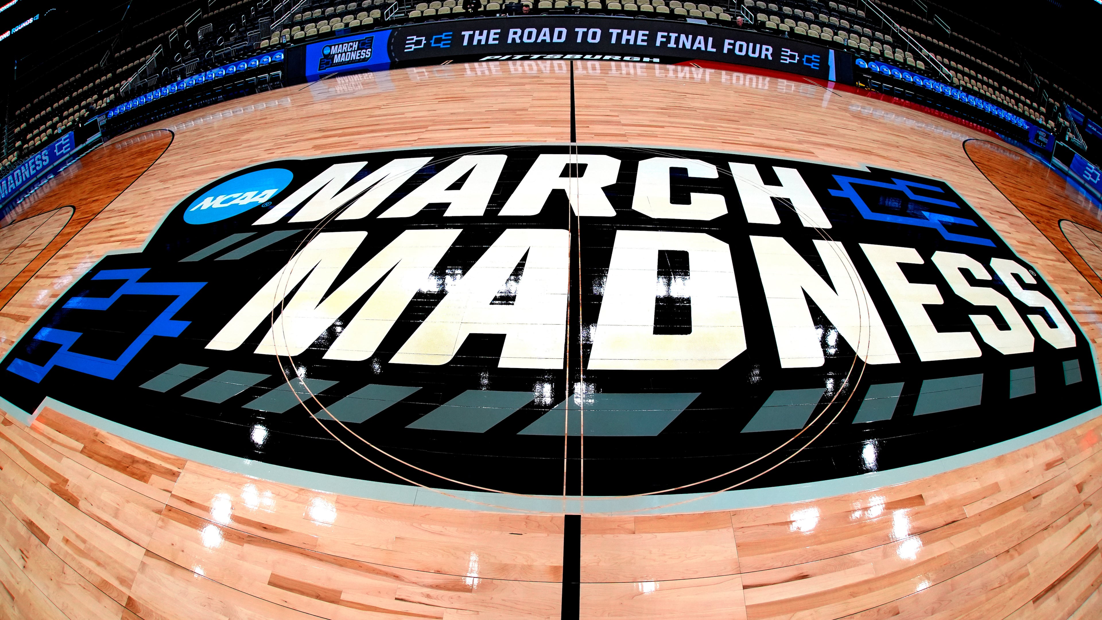 FILE - March Madness logo sis displayed at center court during the opening rounds of the NCAA college basketball tournament in Pittsburgh, Wednesday, March 20, 2024. (AP Photo/Gene J. Puskar, File)