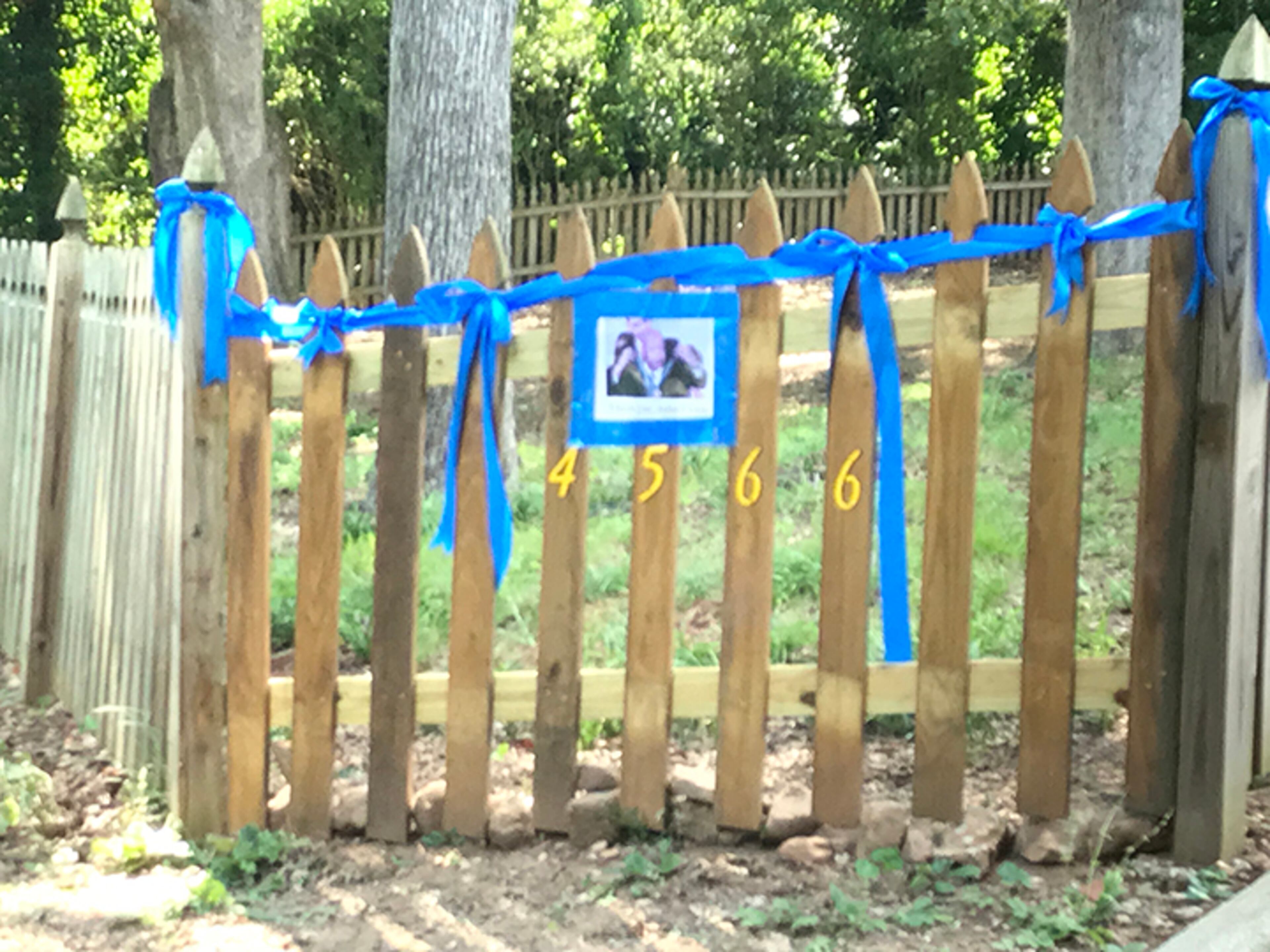 Blue ribbons and a photo of John Lewis on my fence to commemorate my hero, John Lewis. - Wendy Keith-Ott