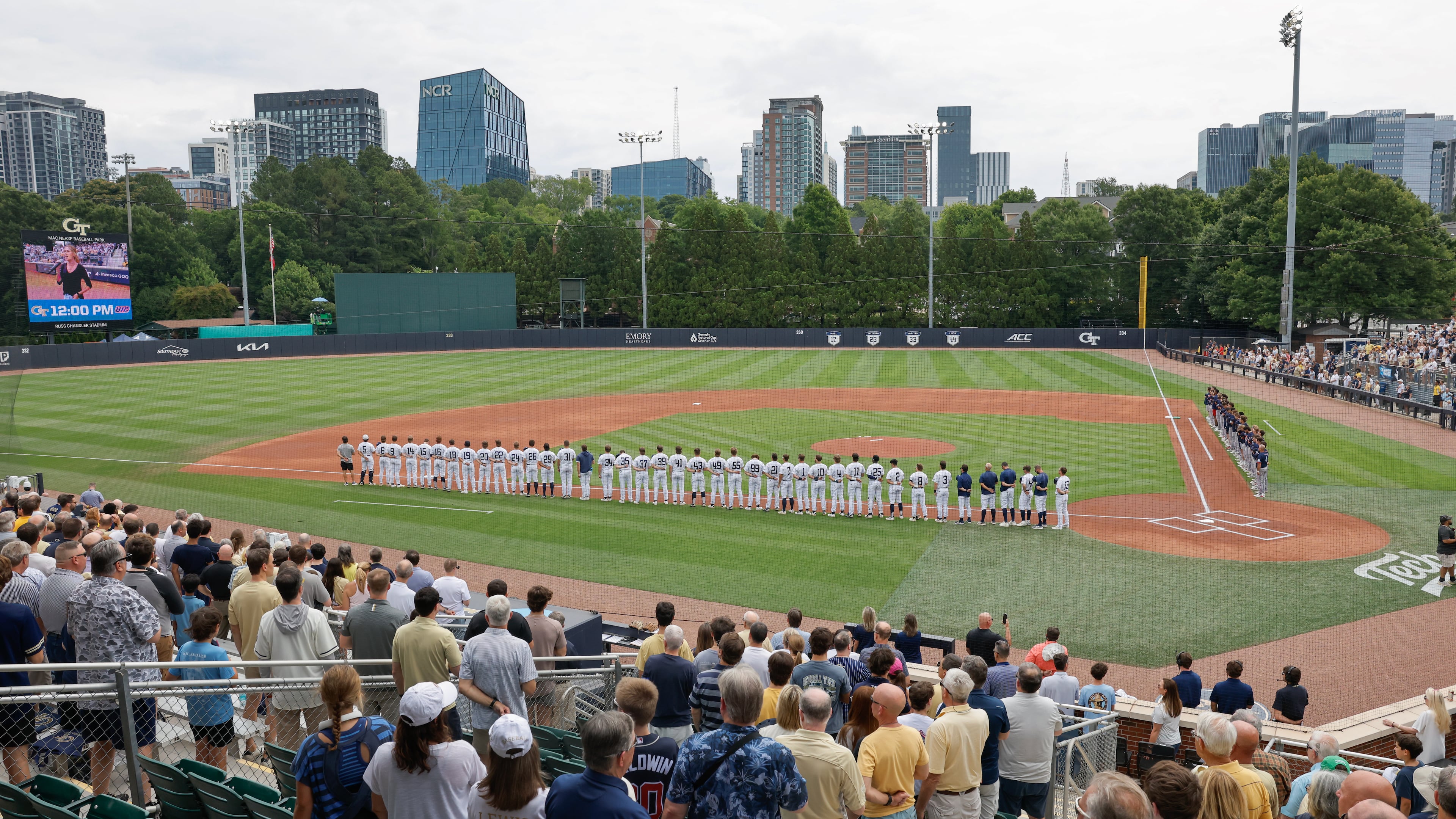 Georgia Tech and Illinois Chicago players and fans stand for the national anthem before the start of their Atlanta Regional game Friday, May 29, 2026, at Russ Chandler Stadium in Atlanta. (Erik S. Lesser for the AJC)