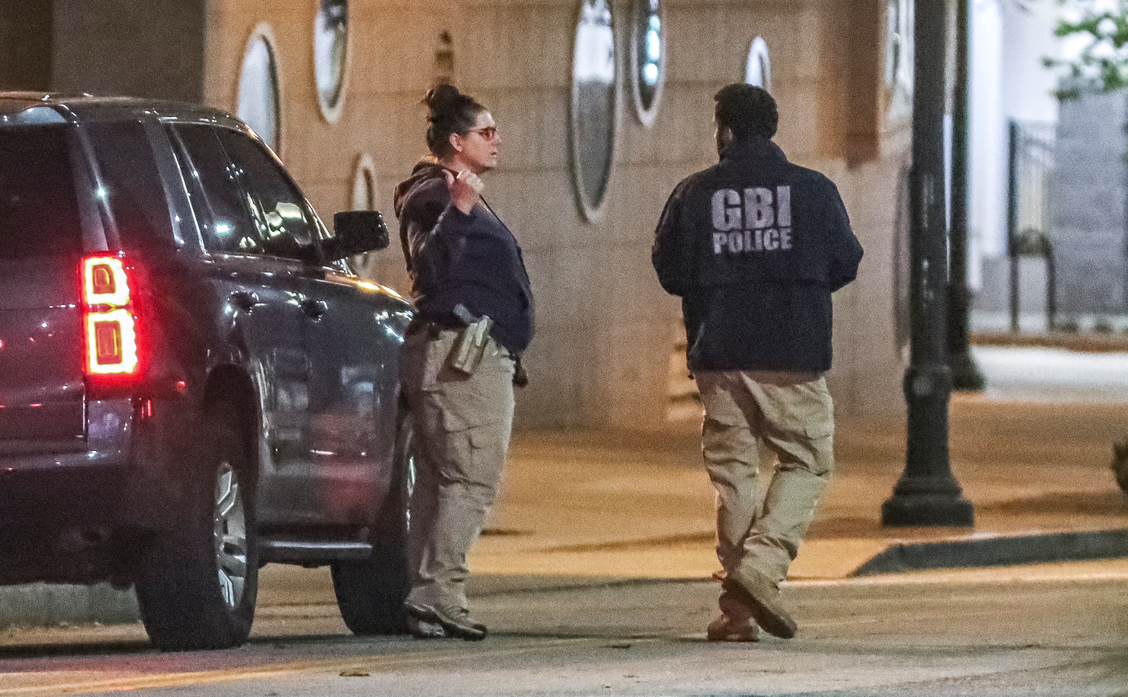 October 26, 2021 Atlanta: The GBI and Atlanta police worked the scene on Tuesday, Oct. 26, 2021 after a Molena police officer working an off-duty job in parking enforcement was shot Monday night as he was sitting in his vehicle in downtown Atlanta, officials said. The officer was working for ATL Plus when he was approached by the alleged gunman on Luckie Street shortly before 10 p.m., according to the GBI. The state agency said the officer took a bullet to the neck and returned fire, fatally wounding the man. The officer’s injuries were not considered life-threatening, GBI spokeswoman Nelly Miles said in a news release. “Agents on scene found the man who died in possession of a firearm,” she said. The names of the two men were not released. A third gunshot victim, a woman, was also found at the scene, according to Atlanta police. She was taken to a hospital with what police believed to be a graze wound. “The preliminary investigation indicates there may have been some type of altercation between the two males that escalated to gunfire,” an Atlanta police spokesman said in a statement. According to Channel 2 Action News, the officer argued with the man about a parking ticket before shots were fired. Officials have not confirmed the motive. Molena is a town of fewer than 500 in southwest Pike County, more than 60 miles south of downtown Atlanta. The injured officer serves in a reserve capacity, according to the GBI. The GBI is investigating the incident as an officer-involved shooting, the 80th such shooting this year. The Atlanta Journal-Constitution also tracks officer-involved shootings that don’t involve the GBI, and those numbers sometimes differ from the GBI’s tally. (John Spink / John.Spink@ajc.com)