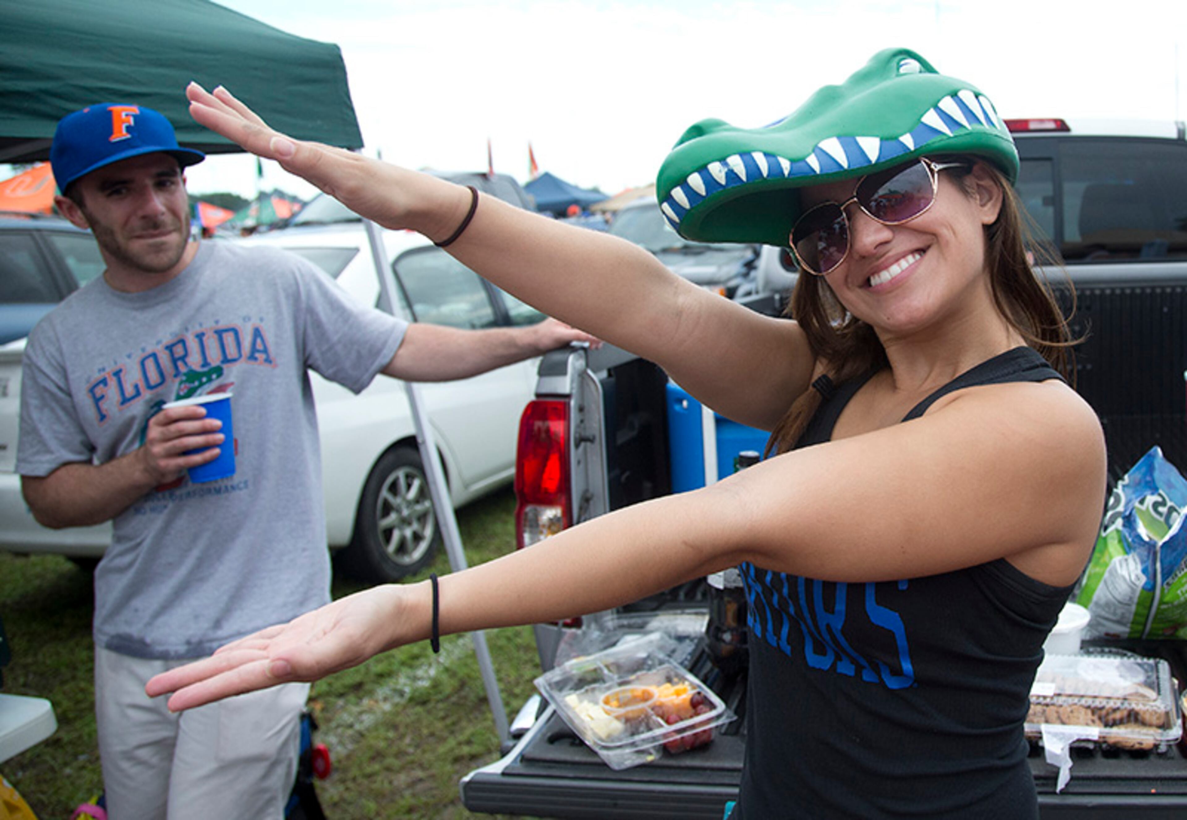 A Florida fan celebrates before a NCAA college football game in Miami Gardens, Fla., Saturday, Sept. 7, 2013 against Miami.