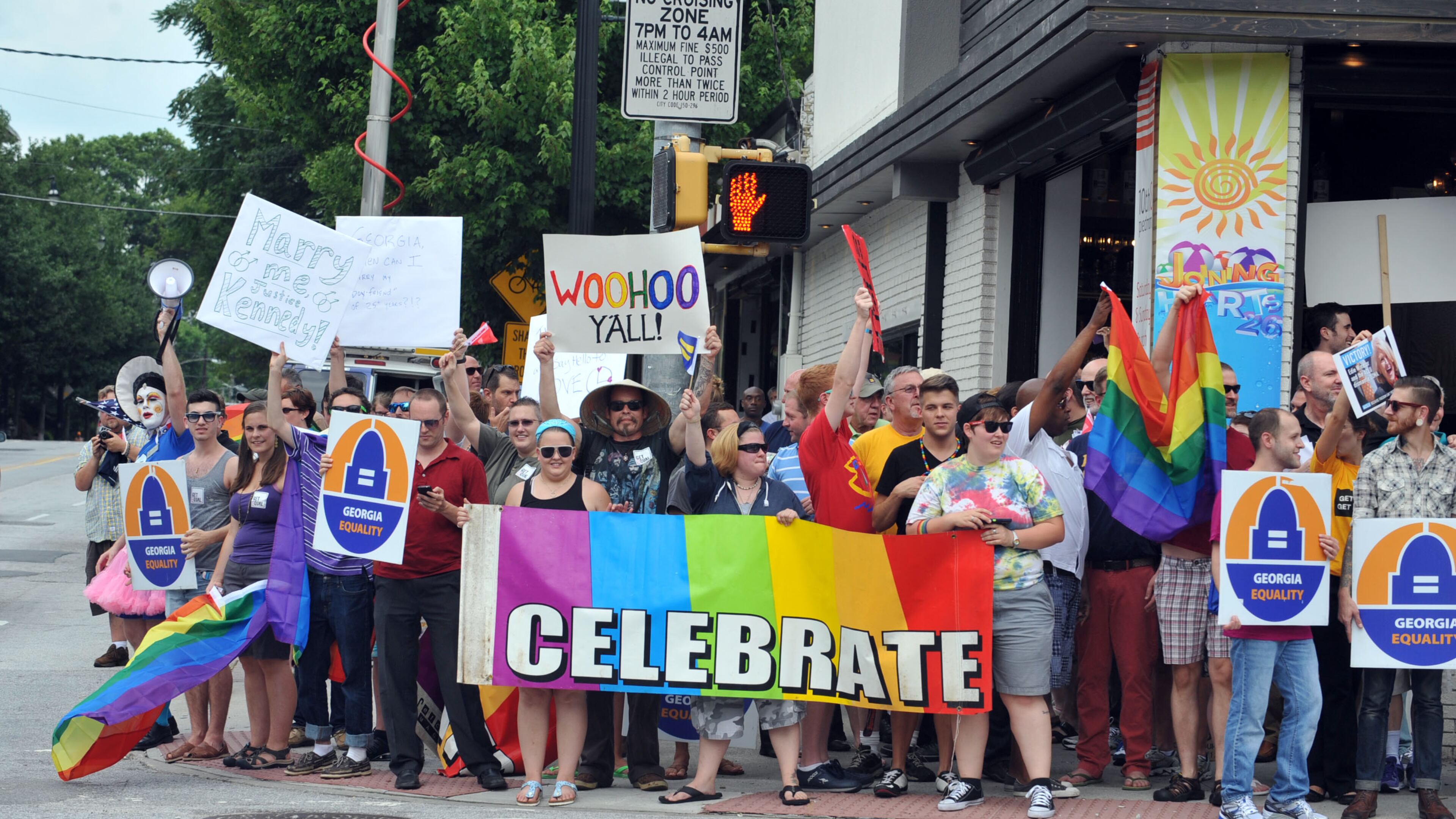 JUNE 26, 2013 ATLANTA Rally participants stood on all four four corners of the intersection. A rally of gay rights supporters cheers the Supreme Court ruling on gay marriage at the corner of Piedmont Ave and 10th Street in Midtown Atlanta Wednesday, June 26, 2013. KENT D. JOHNSON/KDJOHNSON@AJC.COM A pro-gay marriage rally in Atlanta in 2013 (AJC/Kent D. Johnson)