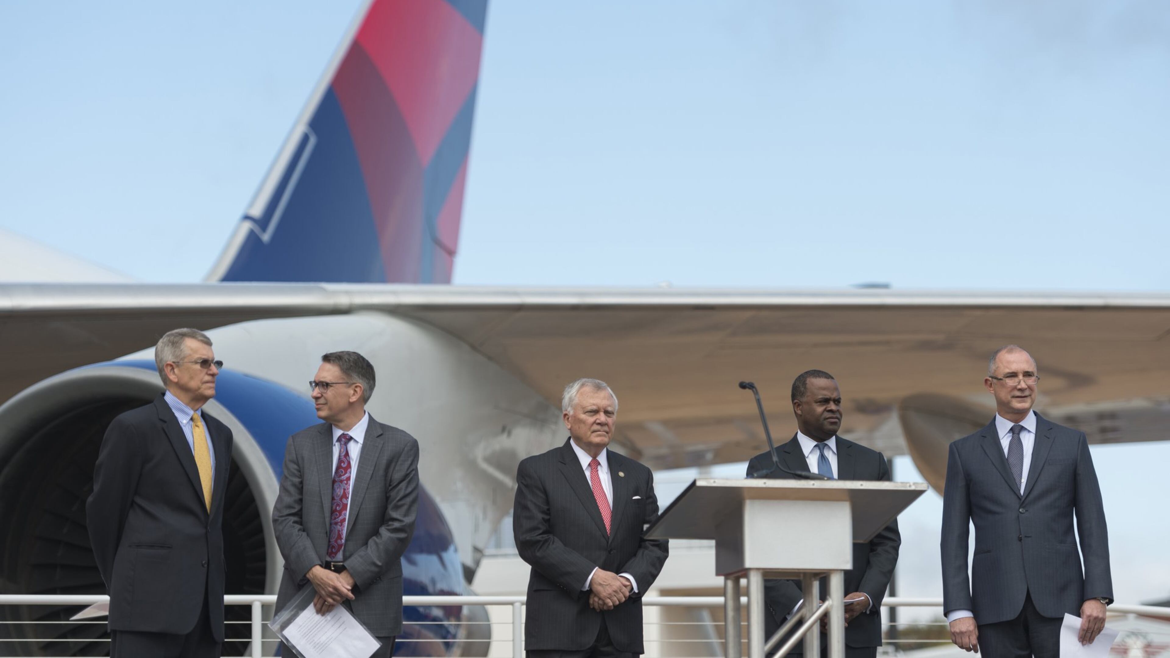 From left, John Boatright, President of the Delta Flight Museum; Randy Tinseth, Vice President of Marketing at Boeing; Georgia Gov. Nathan Deal; Atlanta Mayor Kasim Reed; and Glen Hauenstein, President of Delta Air Lines, prepare for a ceremony to open the new 747 Experience at Delta’s Atlanta museum. (DAVID BARNES / DAVID.BARNES@AJC.COM)