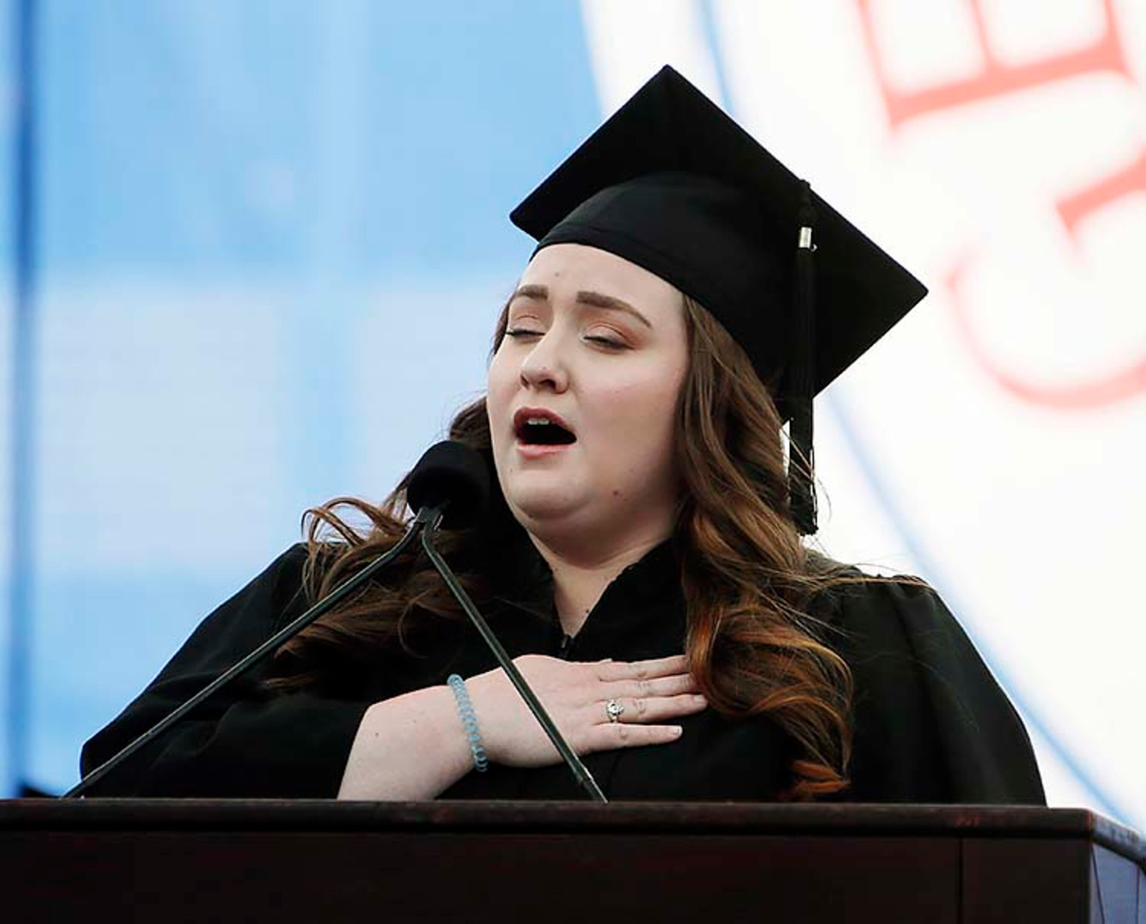 May 9, 2019 - Atlanta - Scarlett Reece sang the National Anthem. Georgia State University is hosting its 104th Commencement Monday, May 6 through Tuesday, May 14 at Panther Stadium in Atlanta. Six schools held their graduation on Thursday. Bob Andres / bandres@ajc.com