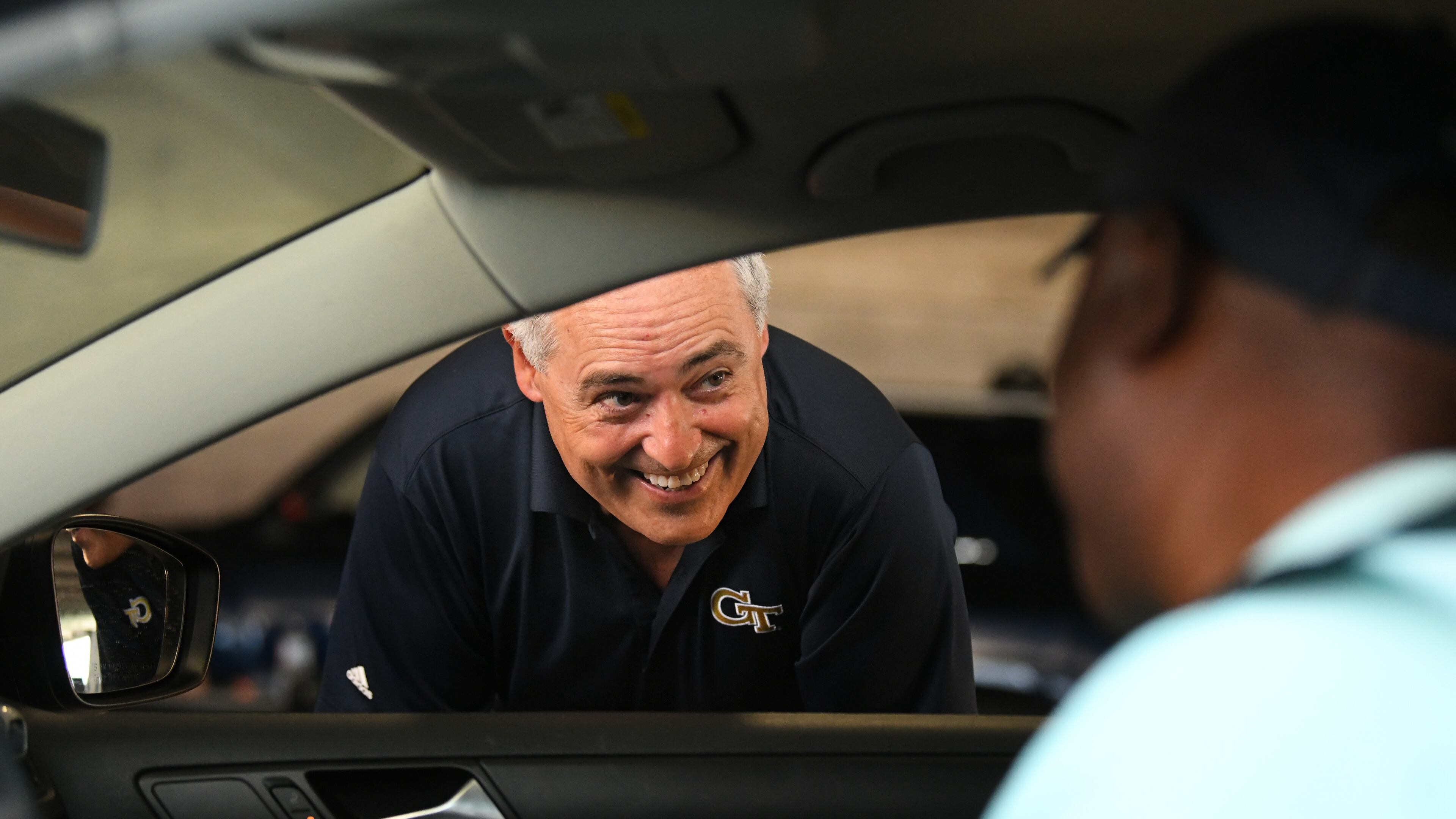 Angel Cabrera (left), president of Georgia Tech, greets students and families as they check-in during the first day of move-in on the Georgia Tech campus on on Saturday, August 14, 2021. Georgia Tech has about 13,000 out-of-country students, which is more than any college or university in the state. (Hyosub Shin / Hyosub.Shin@ajc.com)