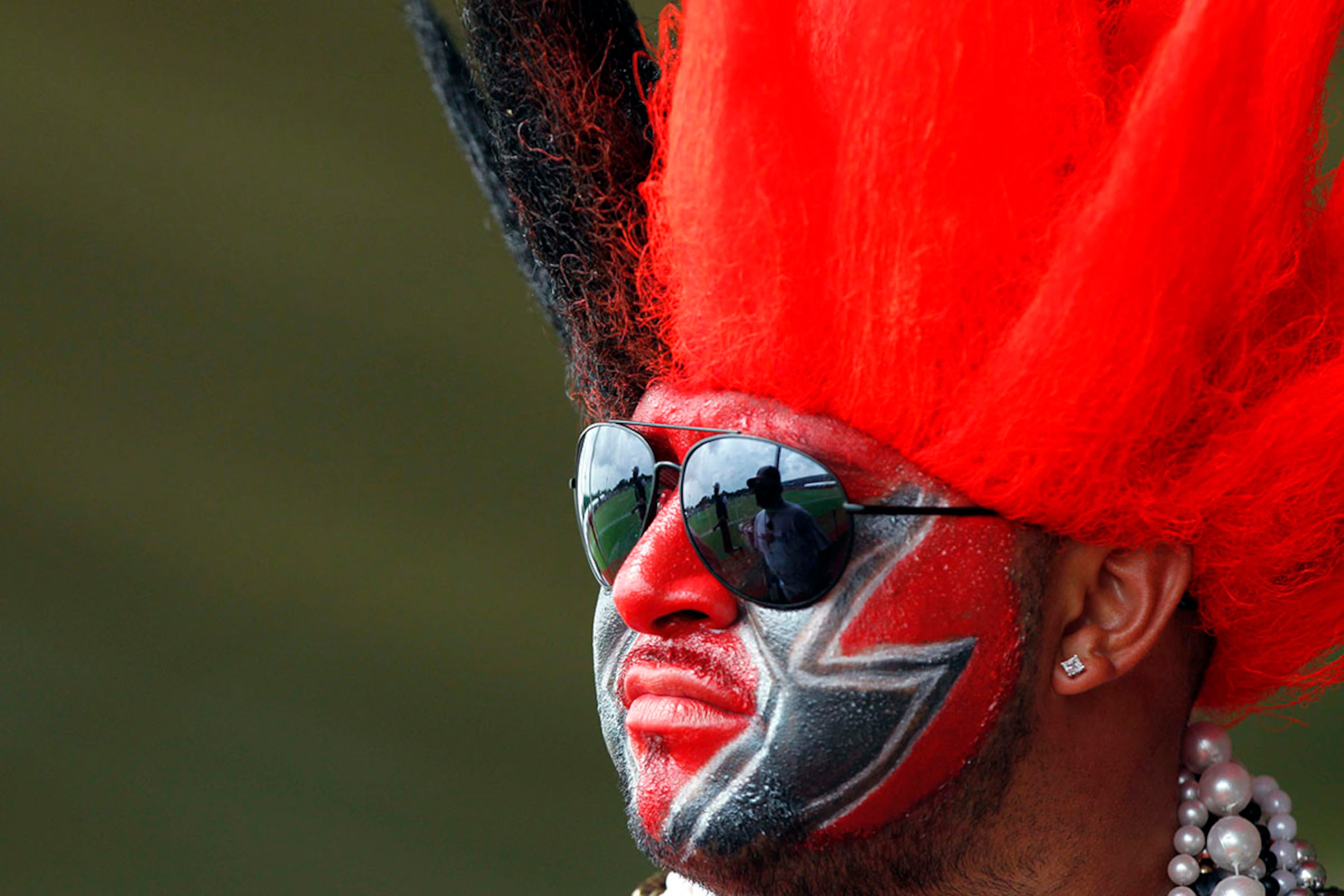 Tampa Bay Buccaneers fan watches practice during training camp at One Buccaneer Place in Tampa.