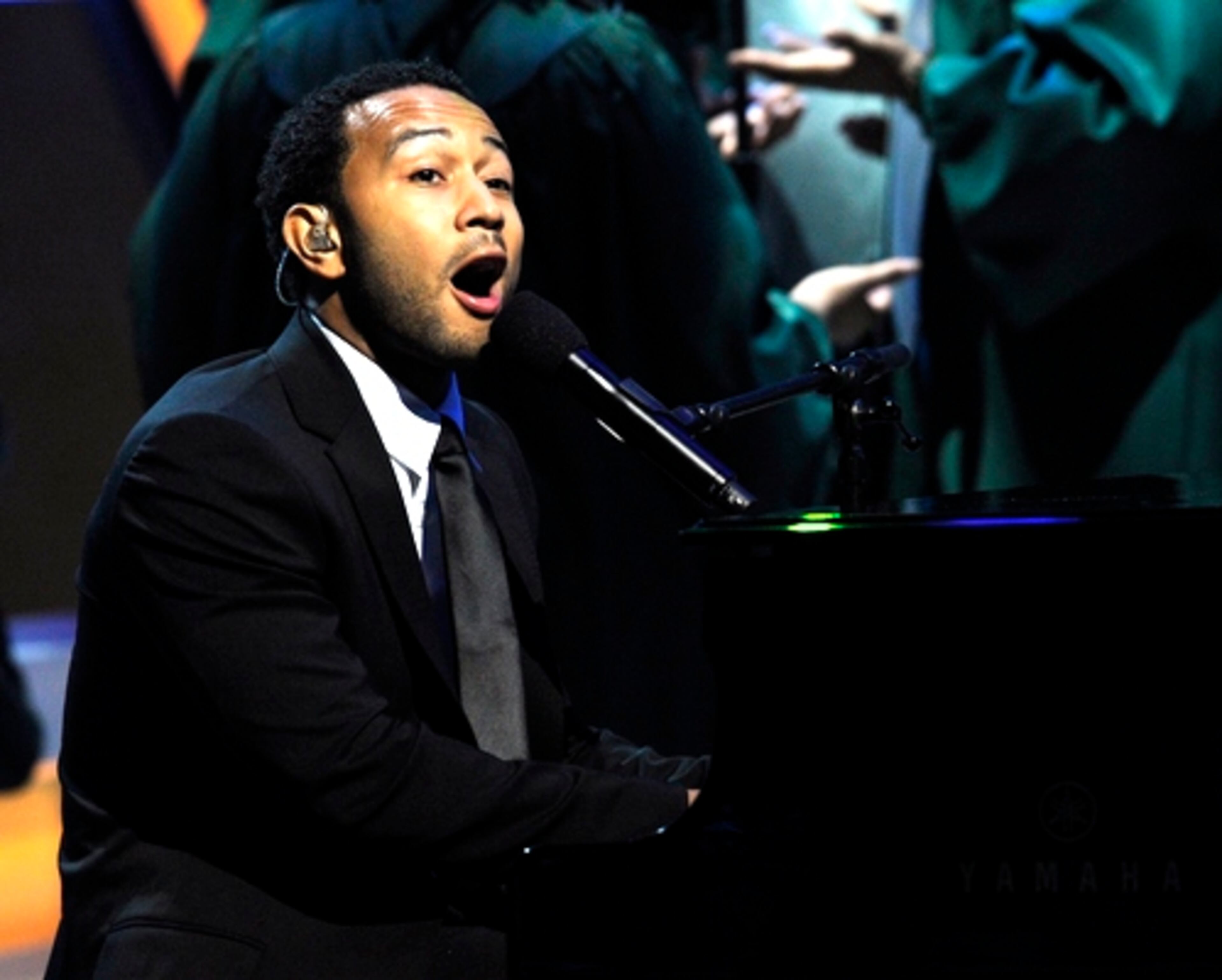 John Legend takes the stage. The concert combines inspirational music and secular music also.