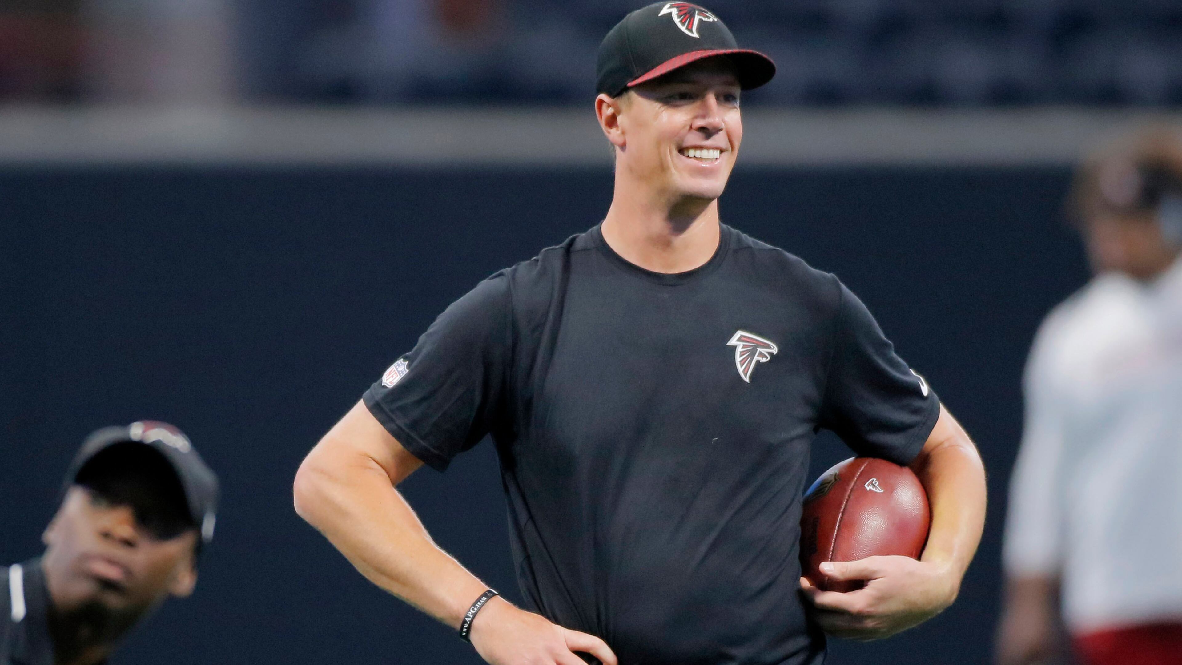 8/26/17 - Atlanta, GA - Atlanta Falcons quarterback Matt Ryan seems to like what he sees as he takes the field for early pregame warmups. The first game in Mercedes-Benz Stadium was Saturday, as the Atlanta Falcons played Arizona in an exhibition game. JOHN SPINK /JSPINK@AJC.COM