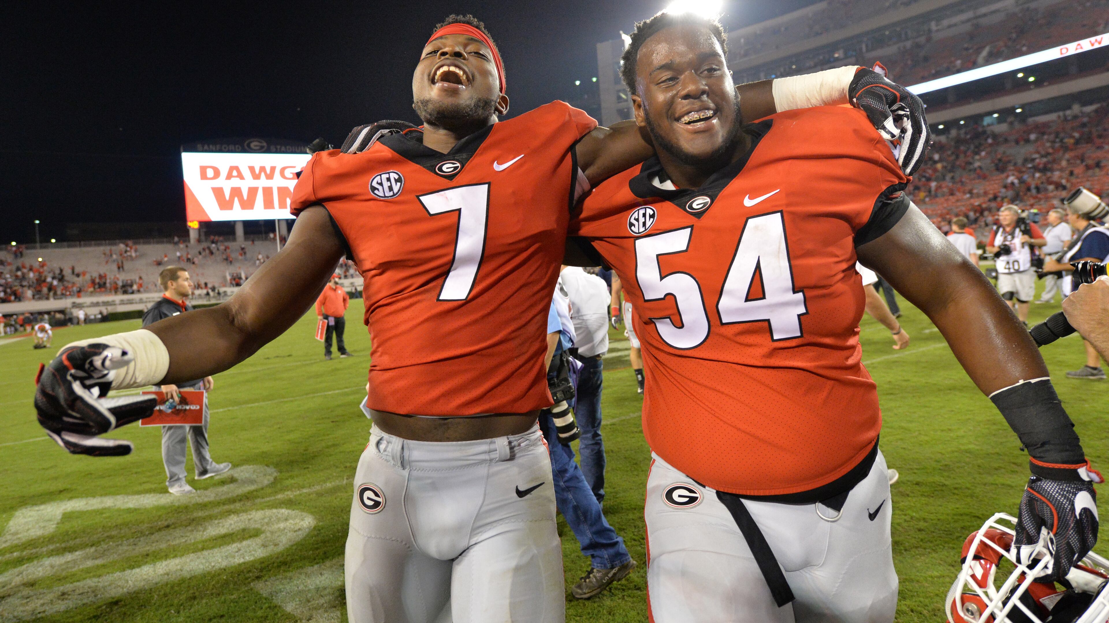 Georgia linebacker Lorenzo Carter (7) and Georgia offensive lineman Justin Shaffer (54) celebrate their win over the Missouri during a NCAA college football game in Athens on Saturday, October 14, 2017. Georgia beat Missouri 28 - 53. HYOSUB SHIN / HSHIN@AJC.COM