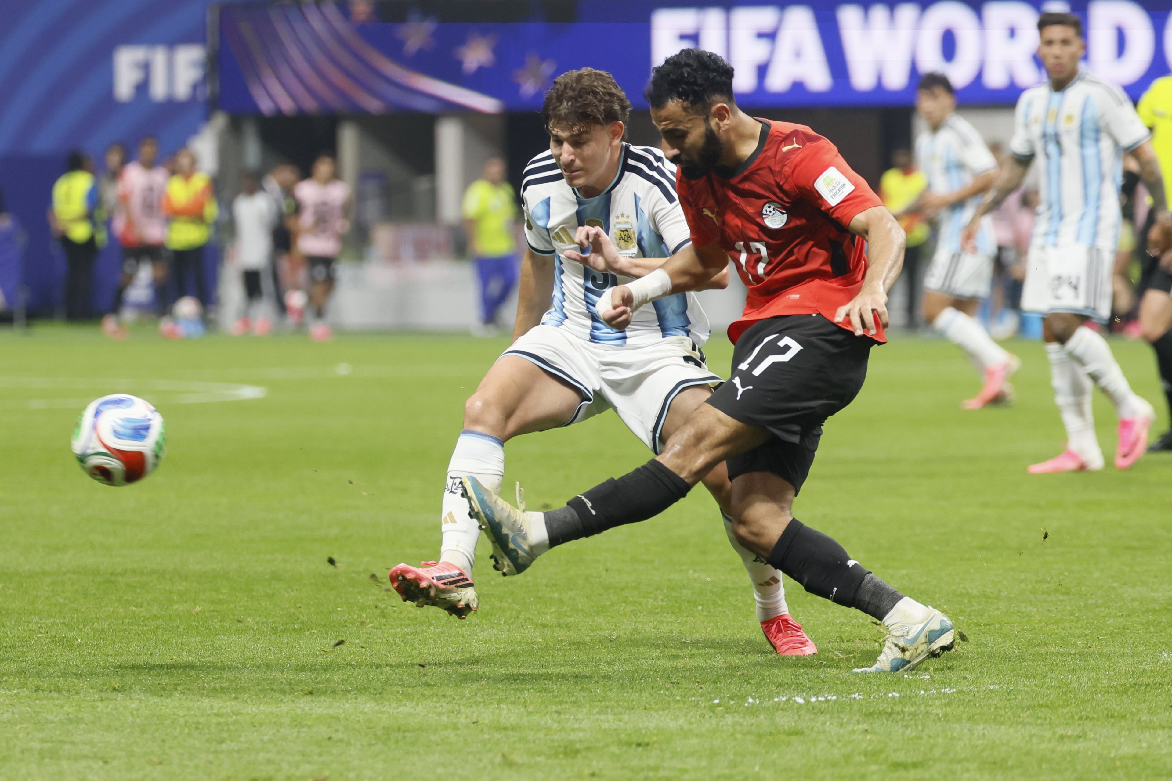 Argentina's Leandro Paredes, left, and Egypt's Mohanad Lashin battle for ball during second half of Argentina vs. Egypt FIFA World Cup match at Atlanta Stadium (Mercedes-Benz Stadium) on Tuesday, July 7, 2026. (Miguel Martinez/AJC)