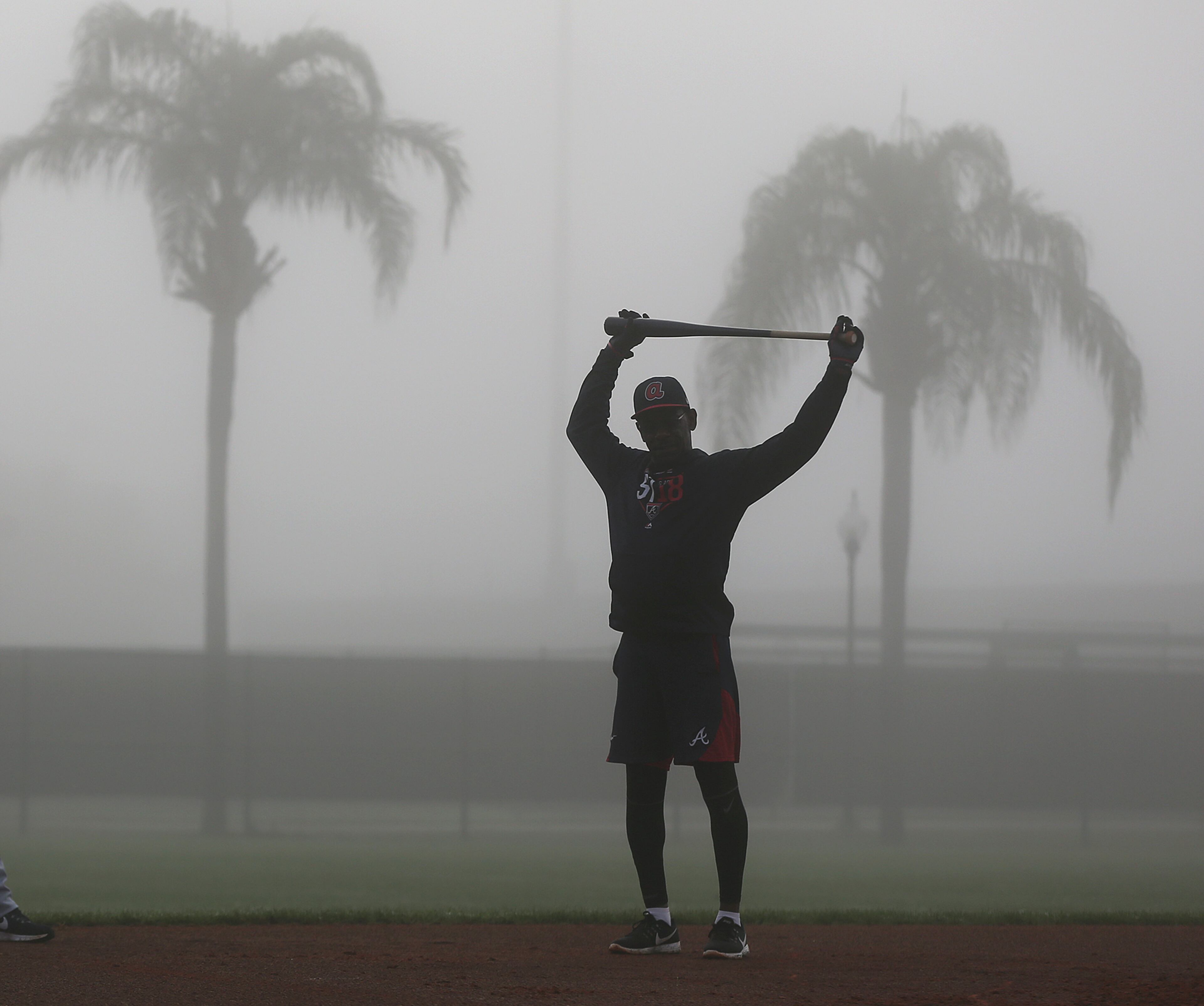 Feb 17, 2018 Lake Buena Vista: Braves third base coach Ron Washington stretches in the dense morning fog getting an early strat during spring training on Saturday, Feb 17, 2018, at the ESPN Wide World of Sports Complex in Lake Buena Vista. Curtis Compton/ccompton@ajc.com
