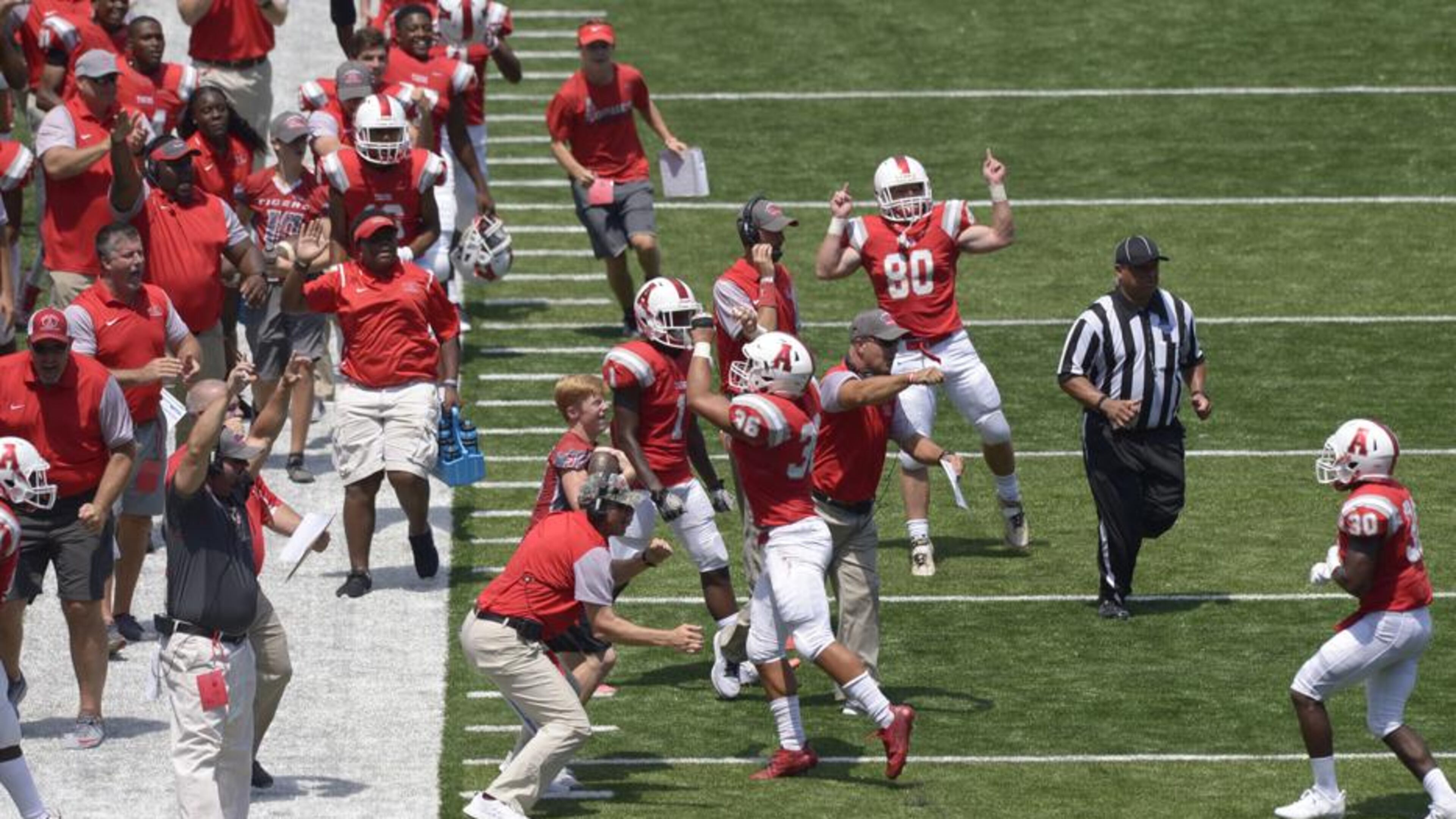 Daniel Varnado/SpecialArcher players and coaches react to touchdown in the second half of their game against Brookwood at Georgia State Field Saturday, August 19, 2017.