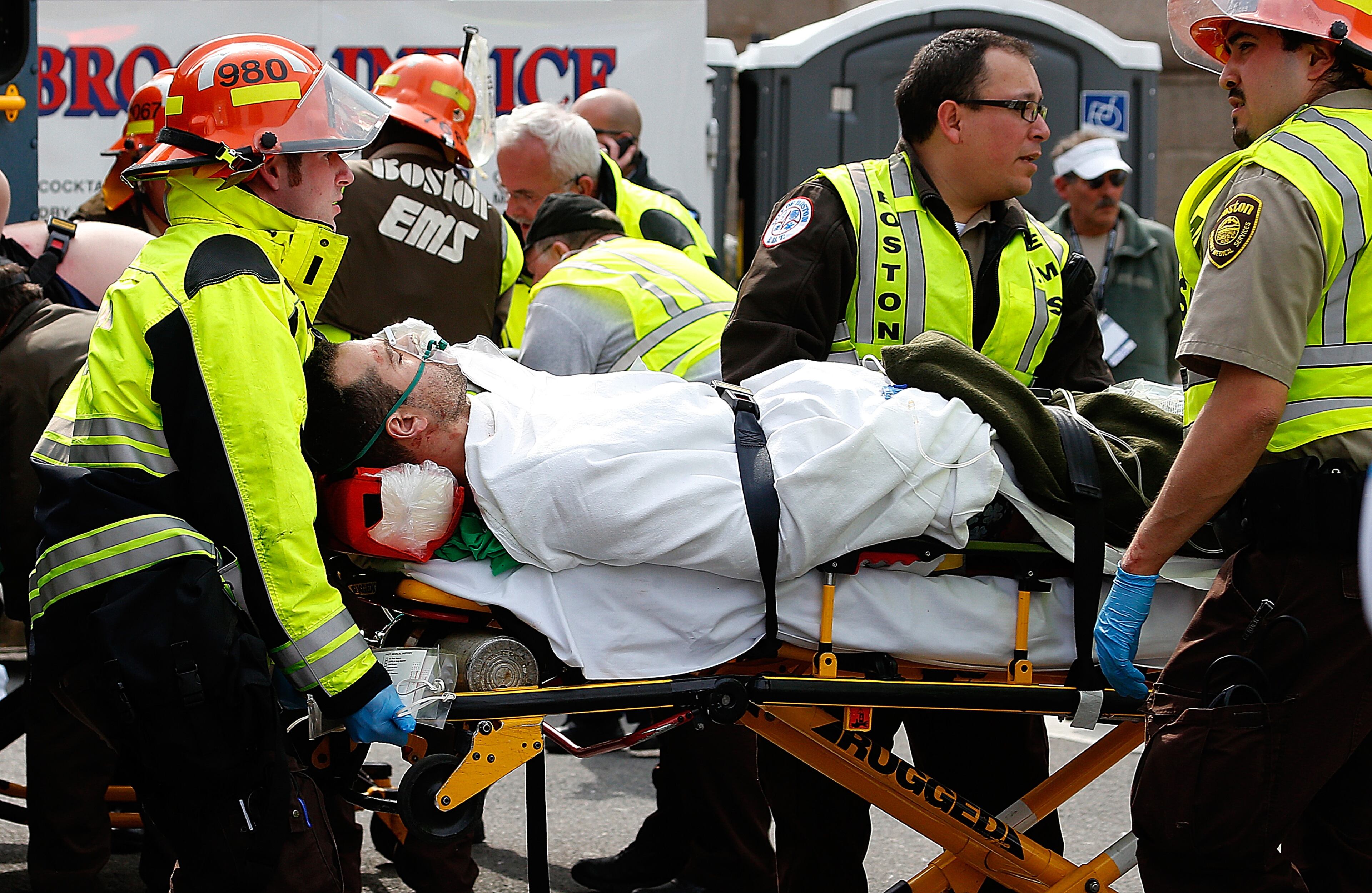 BOSTON, MA - APRIL 15: A man is loaded into an ambulance after he was injured by one of two bombs exploded during the 117th Boston Marathon near Copley Square on April 15, 2013 in Boston, Massachusetts. Two people are confirmed dead and at least 23 injured after two explosions went off near the finish line to the marathon. (Photo by Jim Rogash/Getty Images)