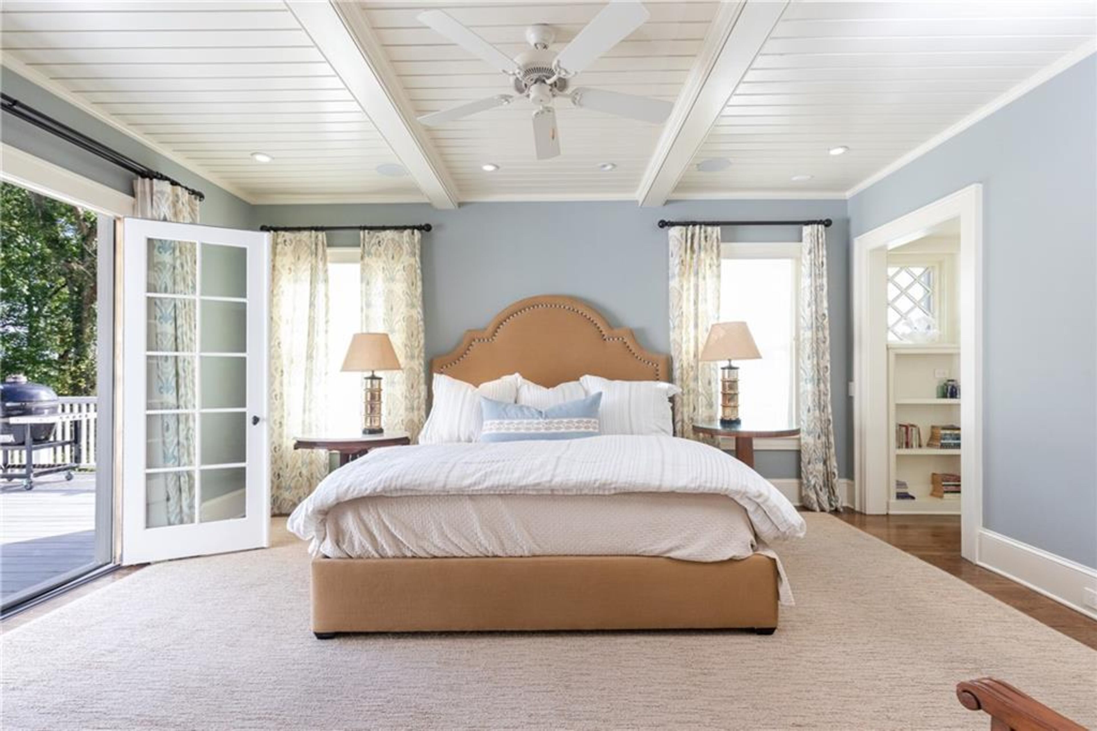 The oversized primary suite boasts its own private sitting room and sleeping porch as well as a luxurious ensuite bath and double walk-in closets.