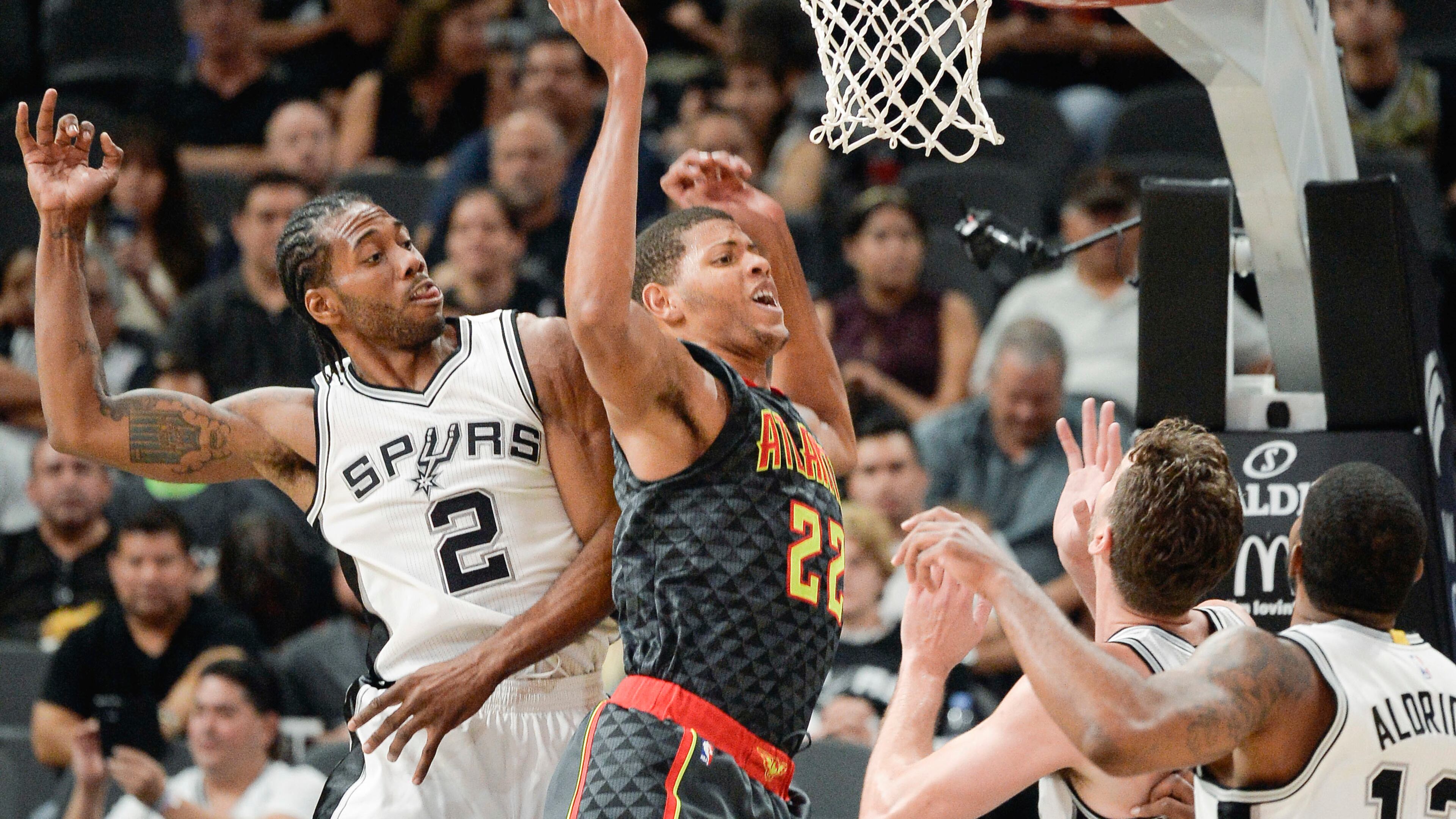 Atlanta Hawks center Walter “Edy” Tavares (22) tangles with San Antonio Spurs’ Kawhi Leonard (2), Pau Gasol, of Spain, and LaMarcus Aldridge, right, during the first half of a preseason NBA basketball game, Saturday, Oct. 8, 2016, in San Antonio. (AP Photo/Darren Abate)