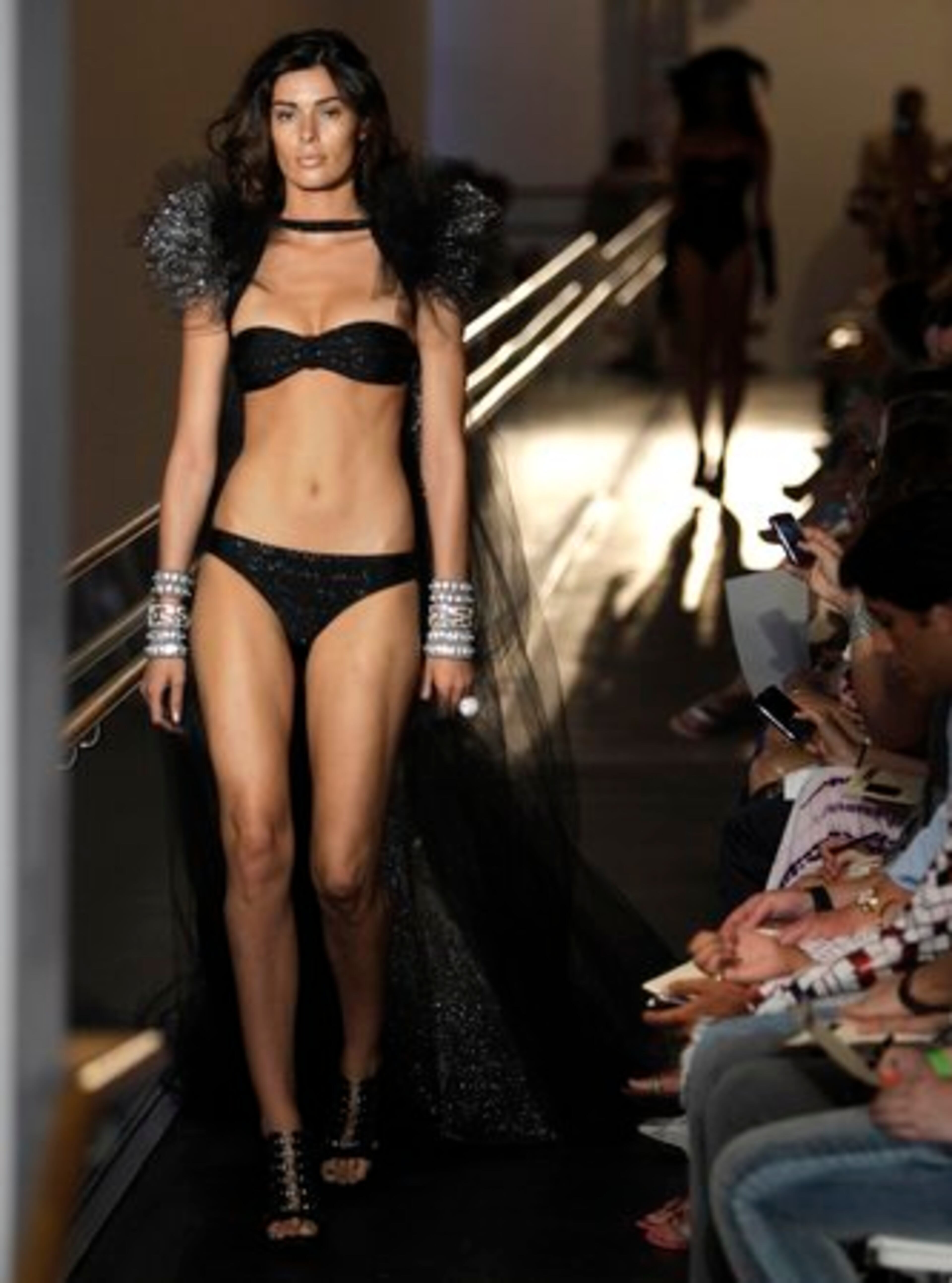 A model walks down the runway during the Red Carter show at the Bass Museum of Art during the Mercedes-Benz Fashion Week Swim 2011.