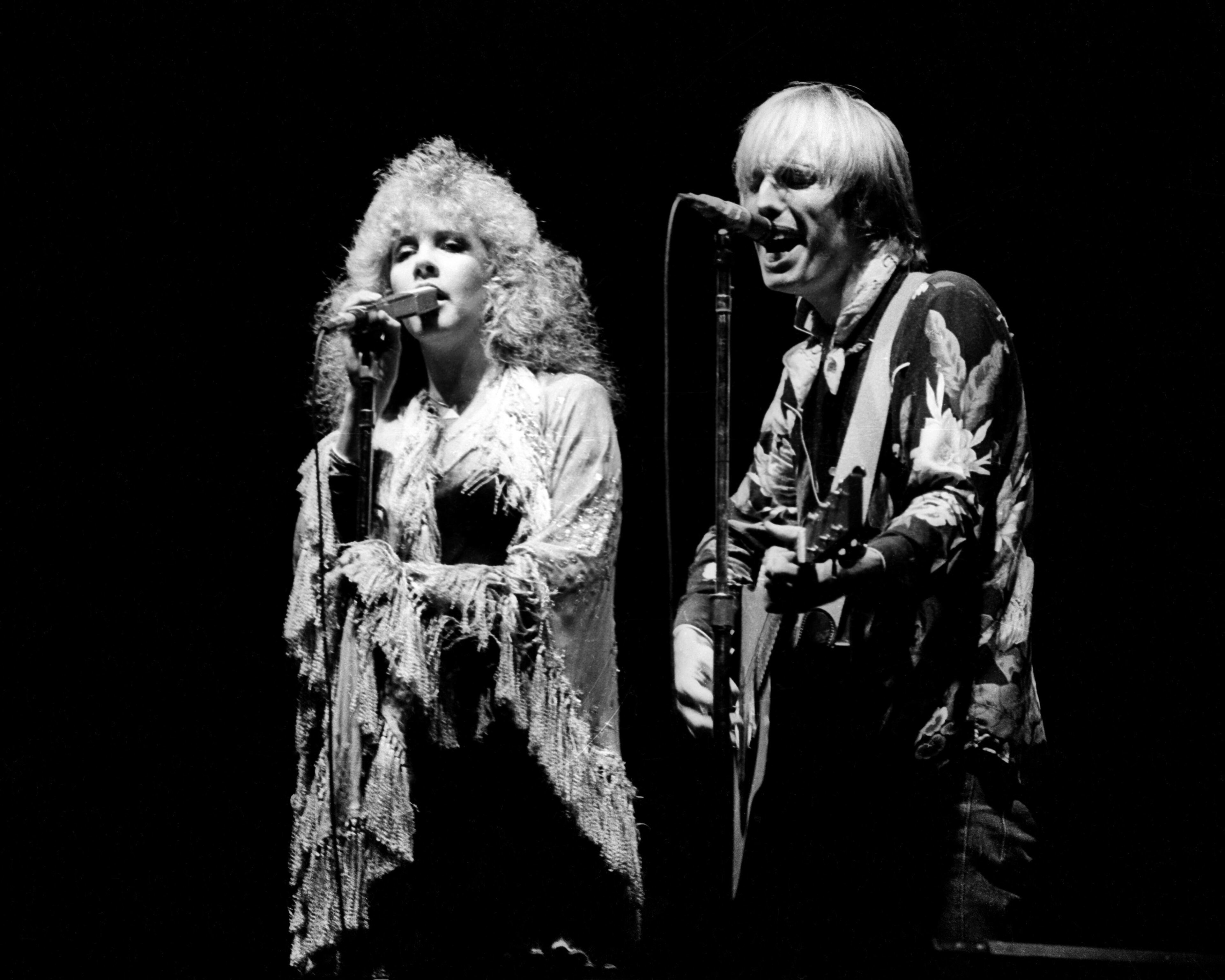 DALY CITY, CA - JUNE 26: Stevie Nicks and Tom Petty perform together at the Cow Palace on June 26, 1981 in Daly City, California. (Photo by Larry Hulst/Michael Ochs Archives/Getty