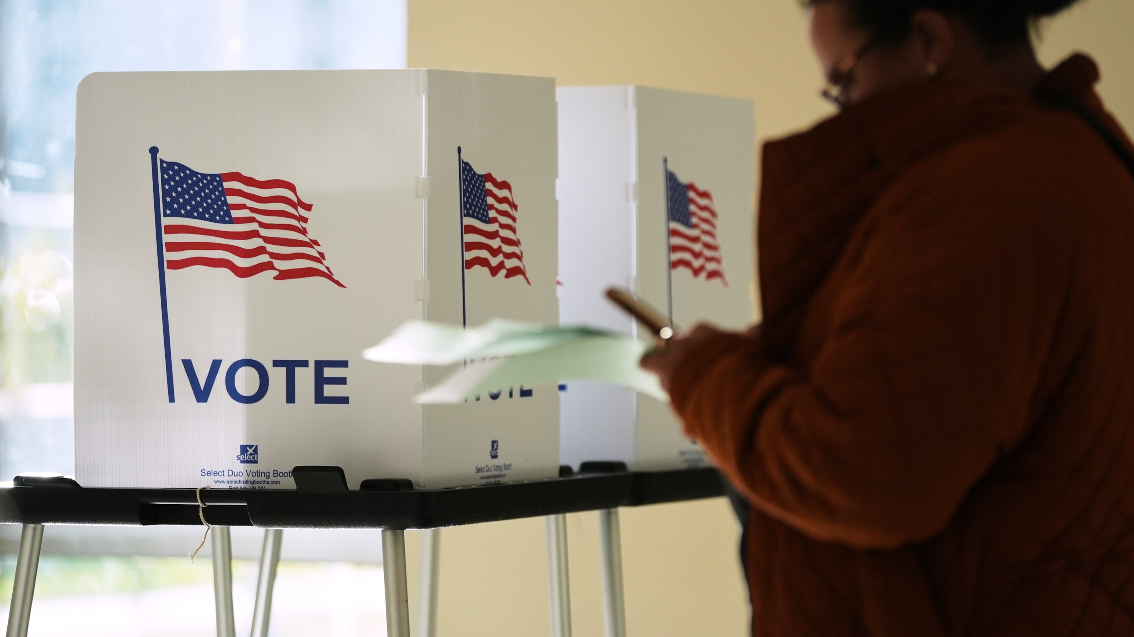 FILE - A person waits to cast a ballot at the Horatio Williams Foundation in downtown Detroit, Nov. 4, 2025. (AP Photo/Ryan Sun, File)