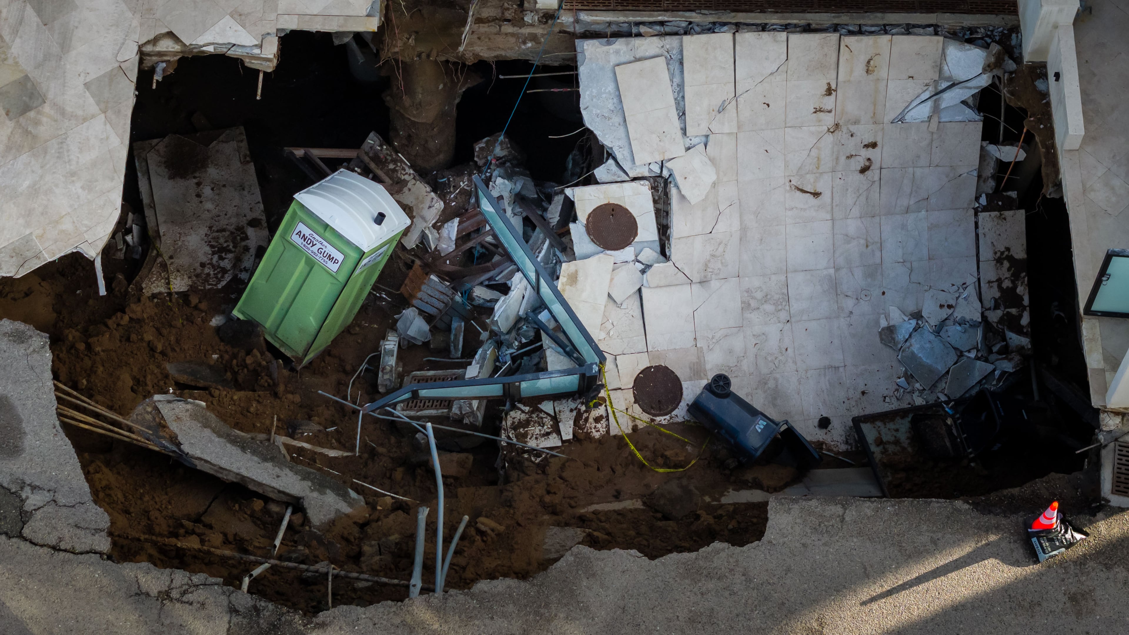 An aerial view of a sinkhole which collapsed the driveway of a coastal mansion owned by actor Nicolas Cage Tuesday, Sept. 8, 2026, in Malibu, Calif. (AP Photo/Ethan Swope)