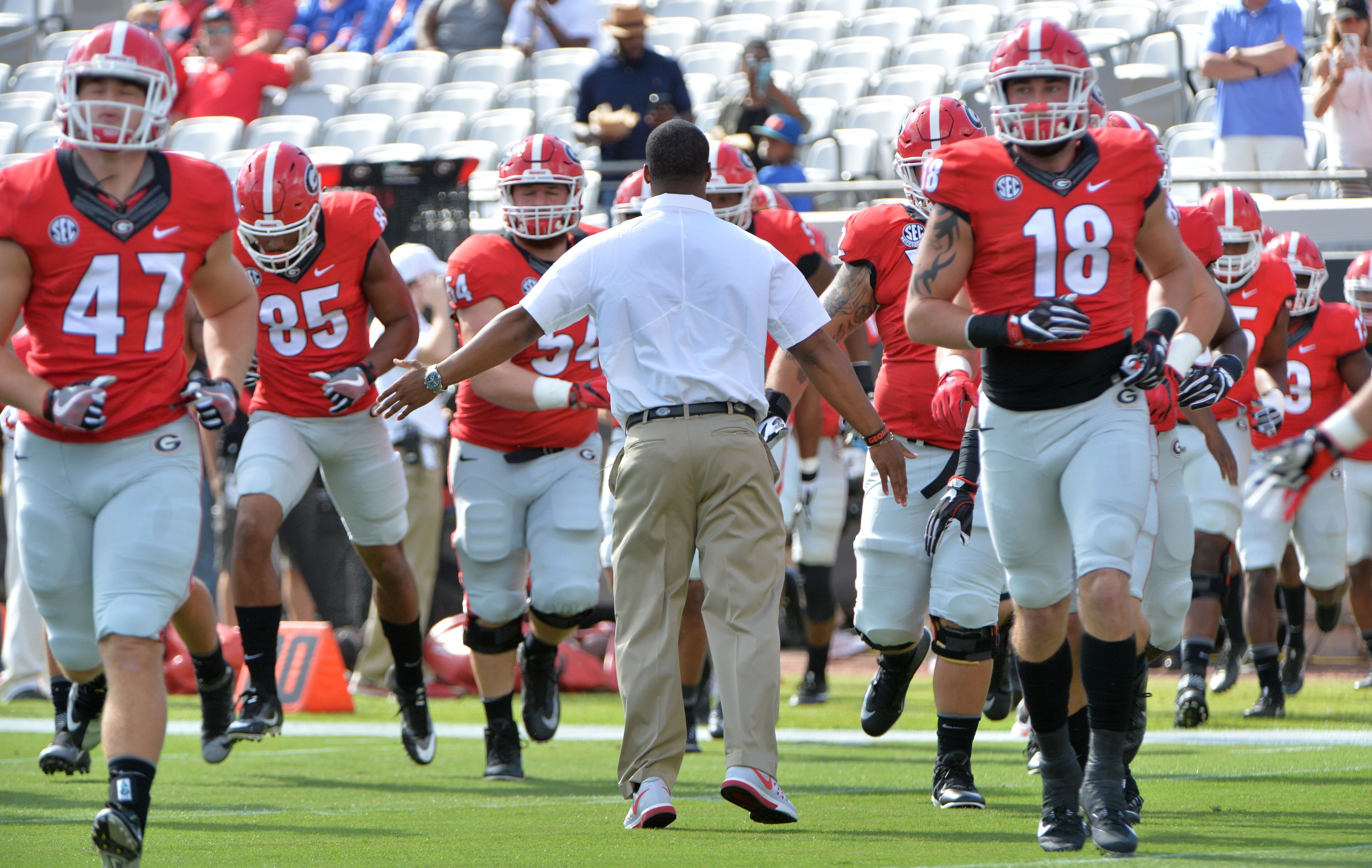 October 29, 2016 Jacksonville, Fla. - Georgia runs onto the football field for pre-game warm-up before their game against the Florida Gators at EverBank Field on Saturday, October 29, 2016. HYOSUB SHIN / HSHIN@AJC.COM