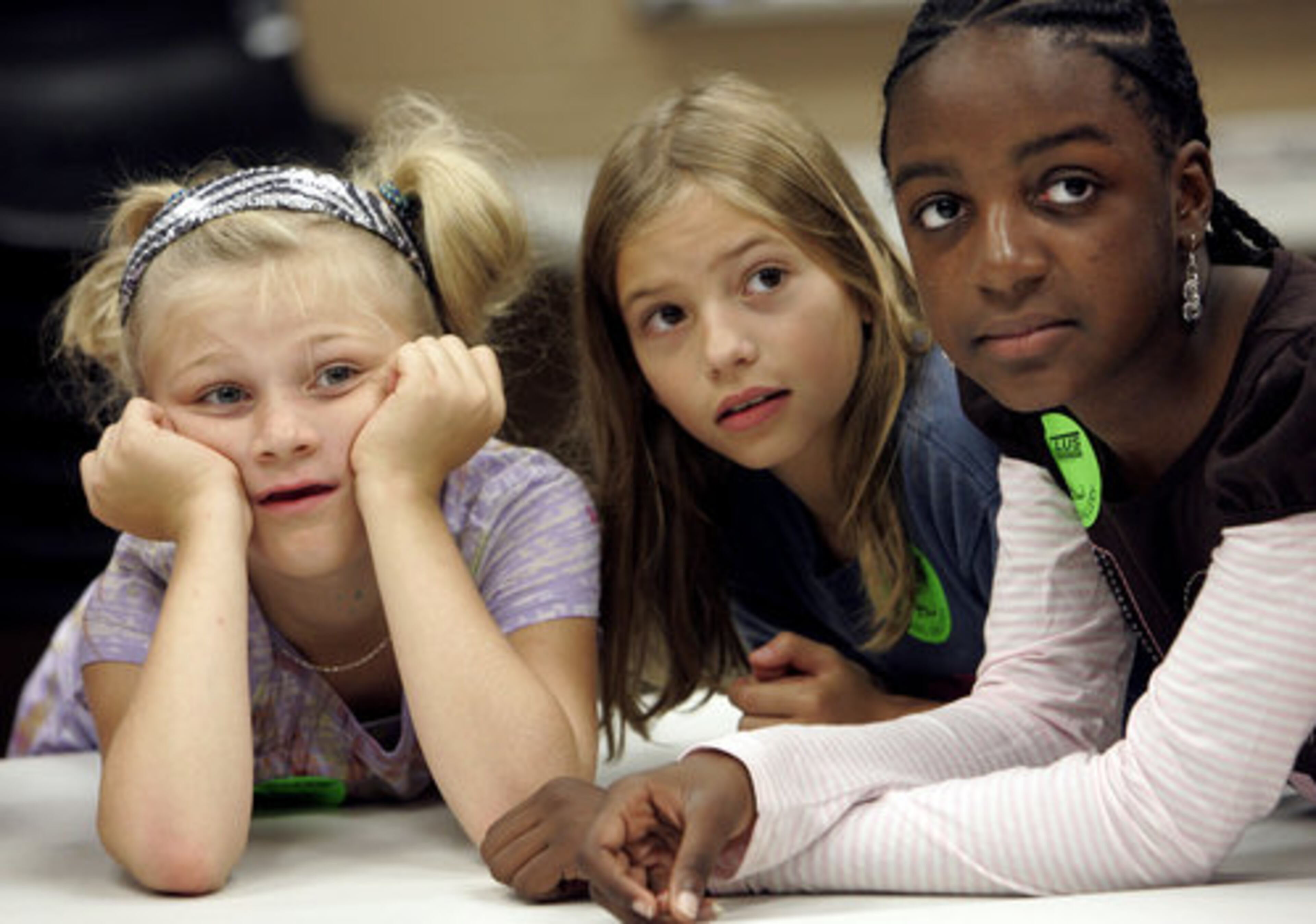 Isabella Faucett (age 9), Carlee Beaty (10) and Zora Seals (9) listen intently to their Tellus tour guide.