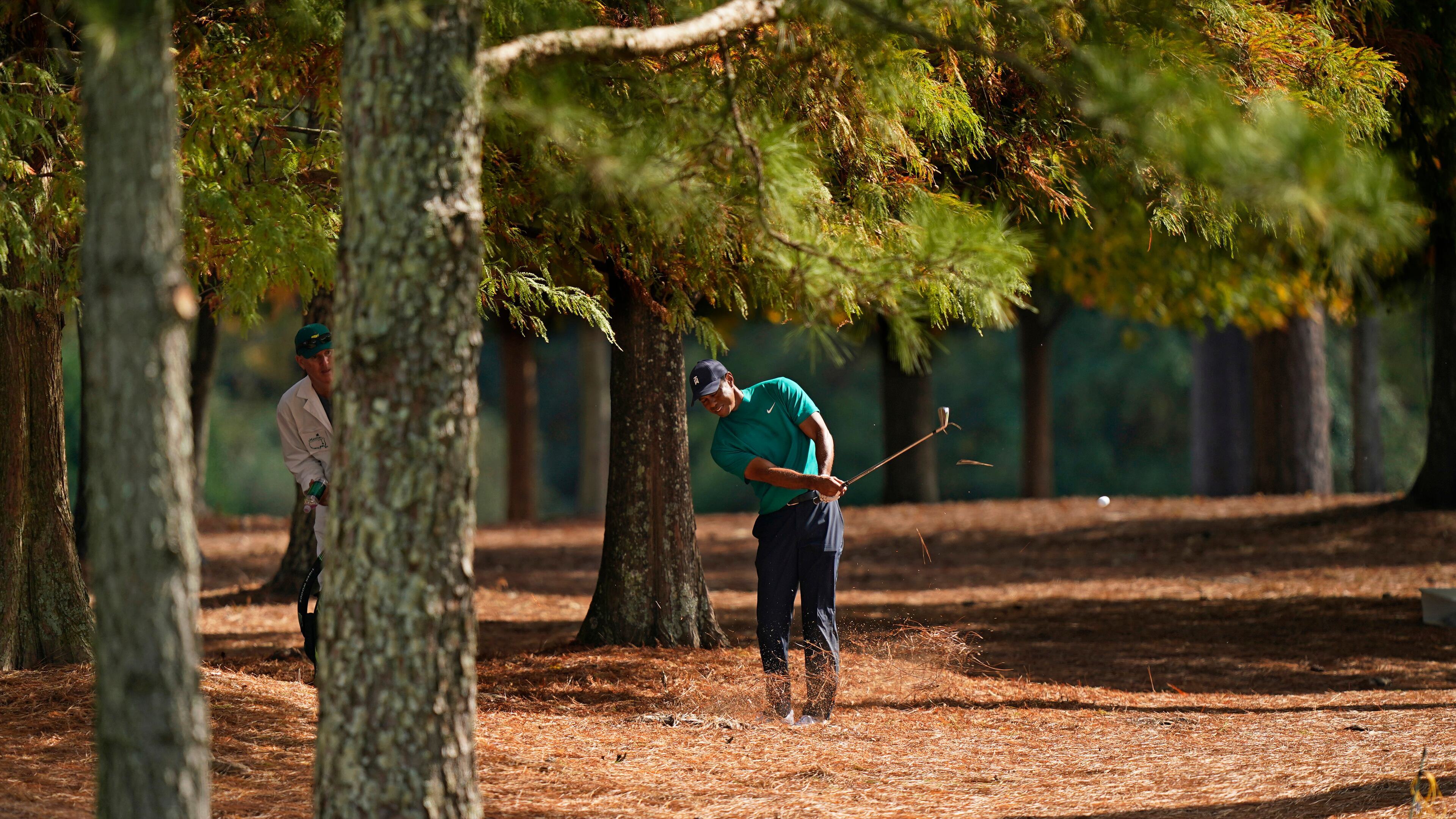 Tiger Woods hits out of the rough on the 13th hole during a practice round for the Masters Tournament Monday, Nov. 9, 2020, in Augusta, Ga. (David J. Phillip/AP)