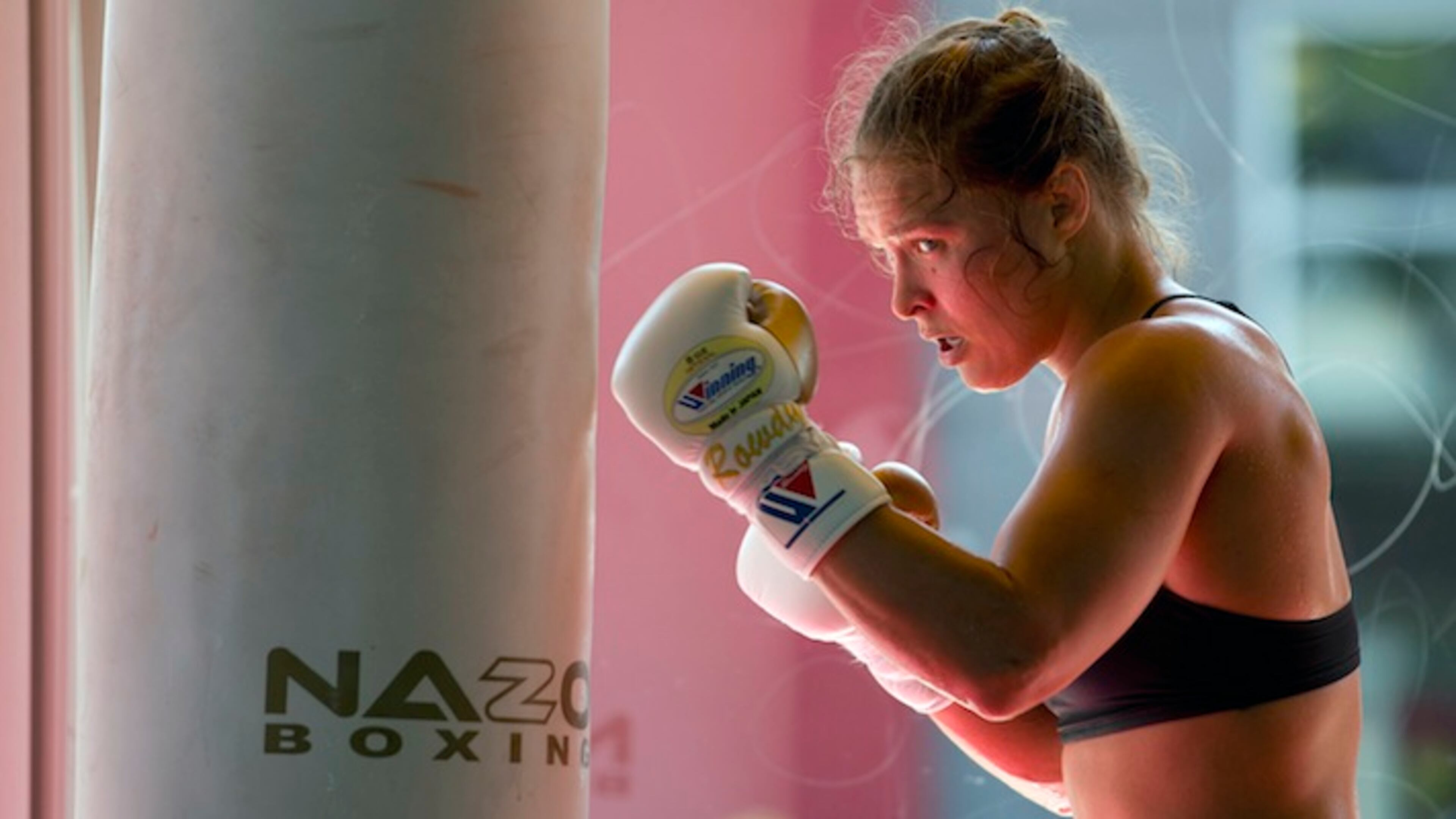 FILE - This July 15, 2015, file photo shows mixed martial arts fighter Ronda Rousey working out at Glendale Fighting Club in Glendale, Calif. Rousey has announced she will fight the world's former No. 1-rated female boxer next. Rousey told ABC's "Good Morning America" on Friday, Aug. 21, 2015, that she will defend her title against Holly Holm in Las Vegas on Jan. 2. (AP Photo/Jae C. Hong,File)