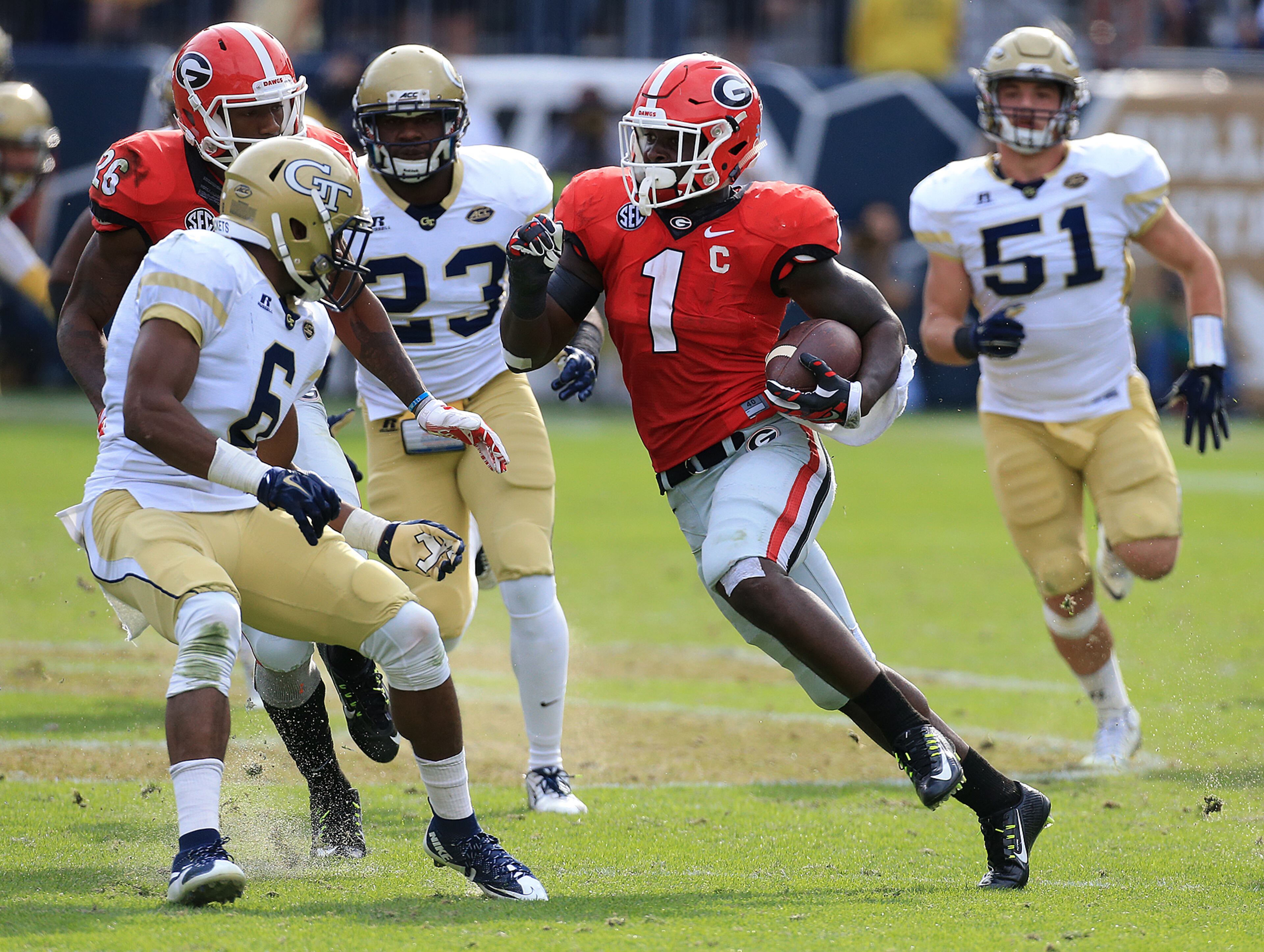 Georgia tailback Sony Michel cuts through Georgia Tech defenders for a long gain during the second half in a football game on Saturday, Nov. 28, 2015, in Atlanta. Curtis Compton / ccompton@ajc.com