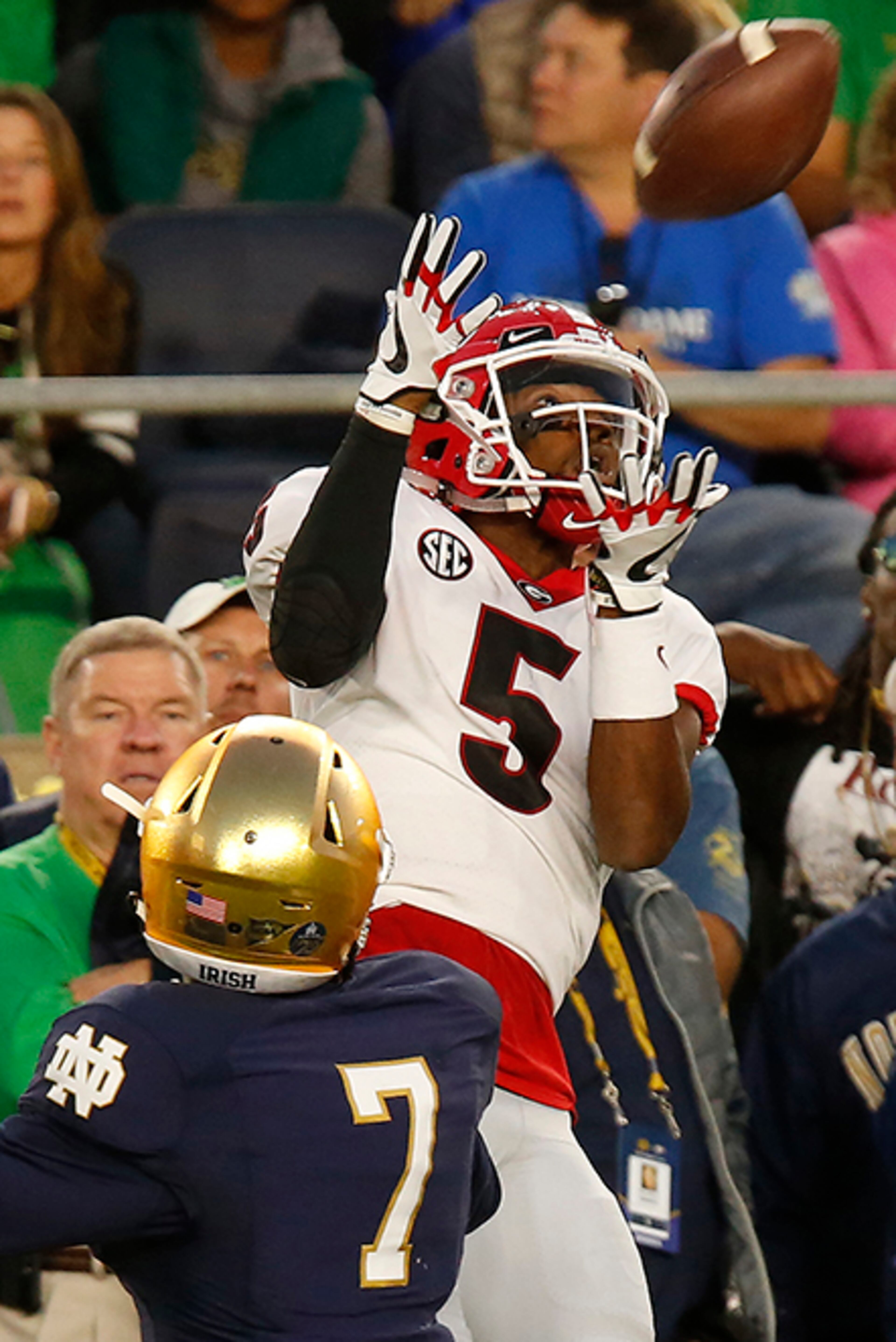 Georgia wide receiver Terry Godwin (5) brings in a pass from quarterback Jake Fromm while being defended by Notre Dame cornerback Nick Watkins (7) during the first half of an NCAA college football game in South Bend, Ind., Saturday, Sept. 9, 2017. (Joshua L. Jones/Athens Banner-Herald via AP)