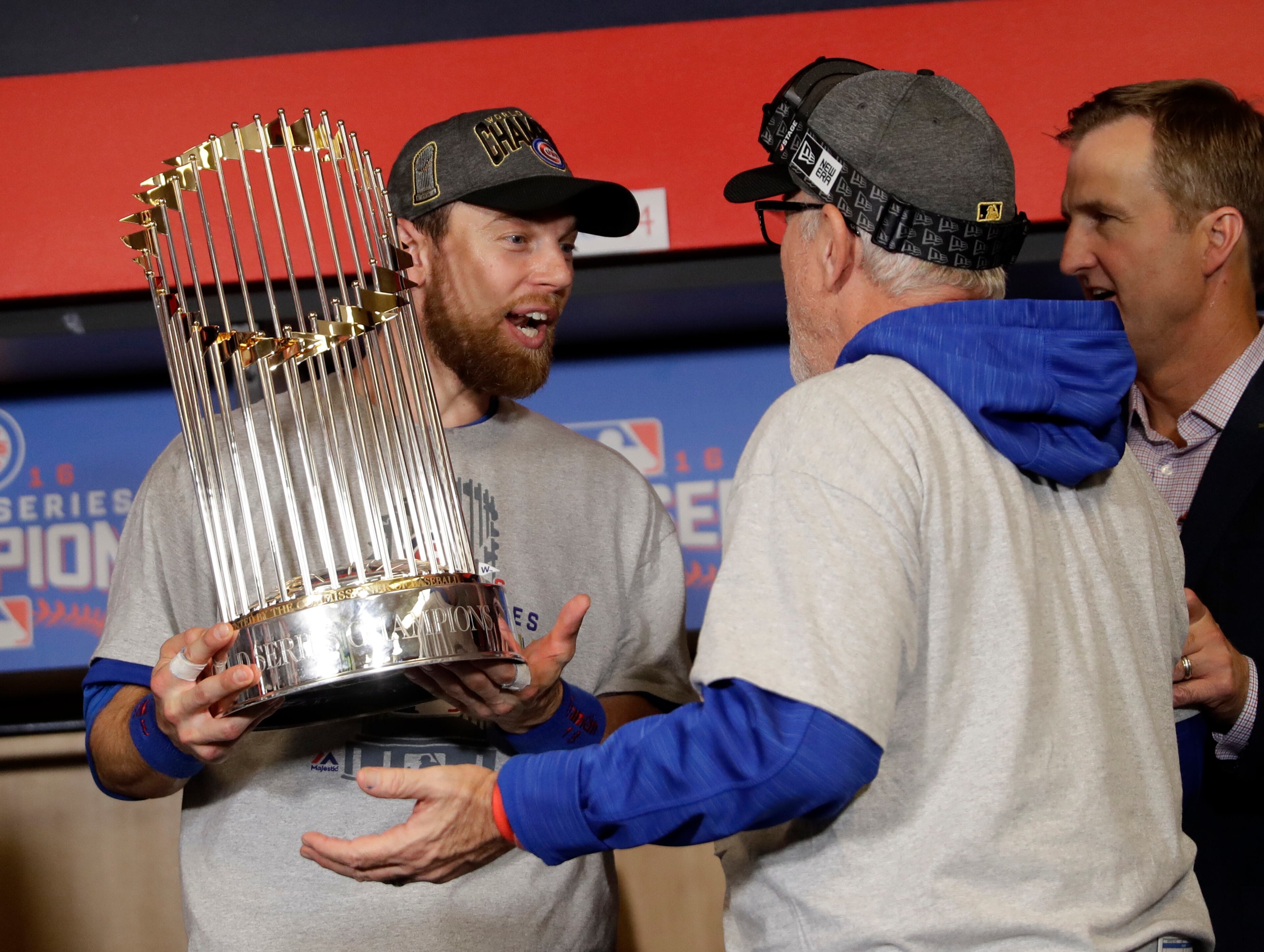 Chicago Cubs' Ben Zobrist and manager Joe Maddon celebrate after Game 7 of the Major League Baseball World Series against the Cleveland Indians Thursday, Nov. 3, 2016, in Cleveland. The Cubs won 8-7 in 10 innings to win the series 4-3. (AP Photo/David J. Phillip)