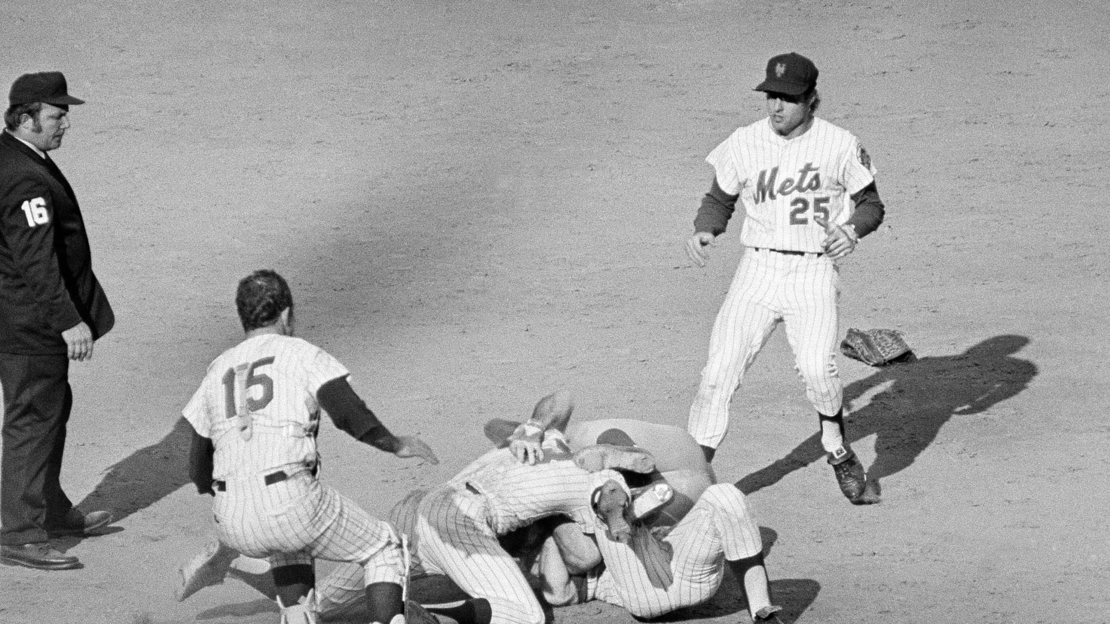 FILE - Pete Rose of the Cincinnati Reds (14) and Bud Harrelson (3) of the New York Mets engage in a tussle after double play action during the fifth inning of the third National League playoff game in New York, Oct. 8, 1973. (AP Photo/Harry Harris, File)