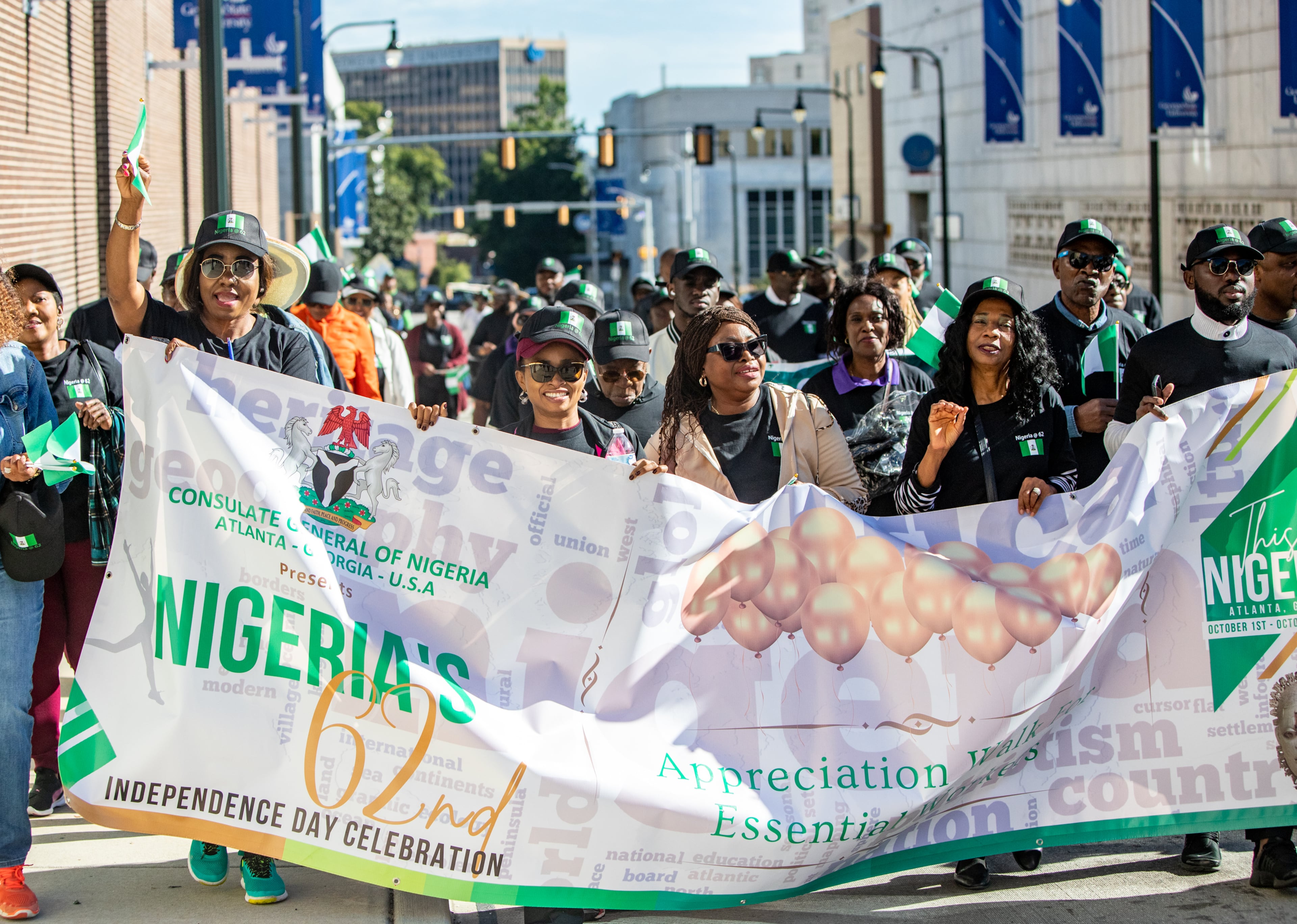 In celebration of Nigeria's Independence Day, marchers return from their walk to Grady Memorial Hospital to show support for frontline health care workers on Saturday, Oct. 1, 2022, in Atlanta. The two-day celebration includes an Independence Gala on Saturday evening and an Art and Cultural Festival on Sunday at Millennium Gate in Atlantic Station. (Photo: Jenni Girtman for The Atlanta Journal-Constitution)