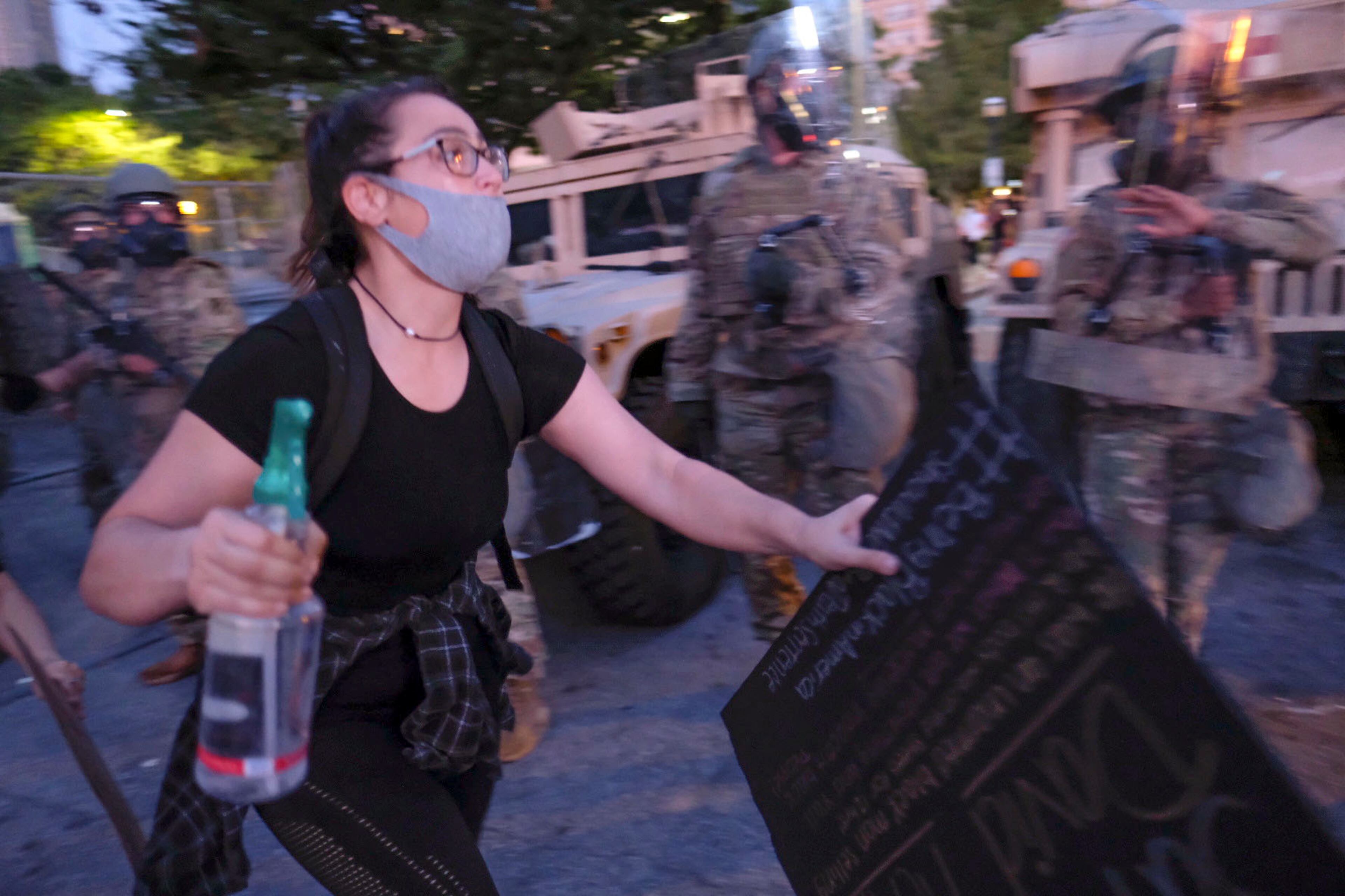 June 2, 2020 - Atlanta - Protestors dodge tear gas and police after the 9pm curfew in downtown Atlanta as protests continued for a fourth day. Protests over the death of George Floyd in Minneapolis police custody continued around the United States, as his case renewed anger about others involving African Americans, police and race relations. Ben Gray for the Atlanta Journal Constitution
