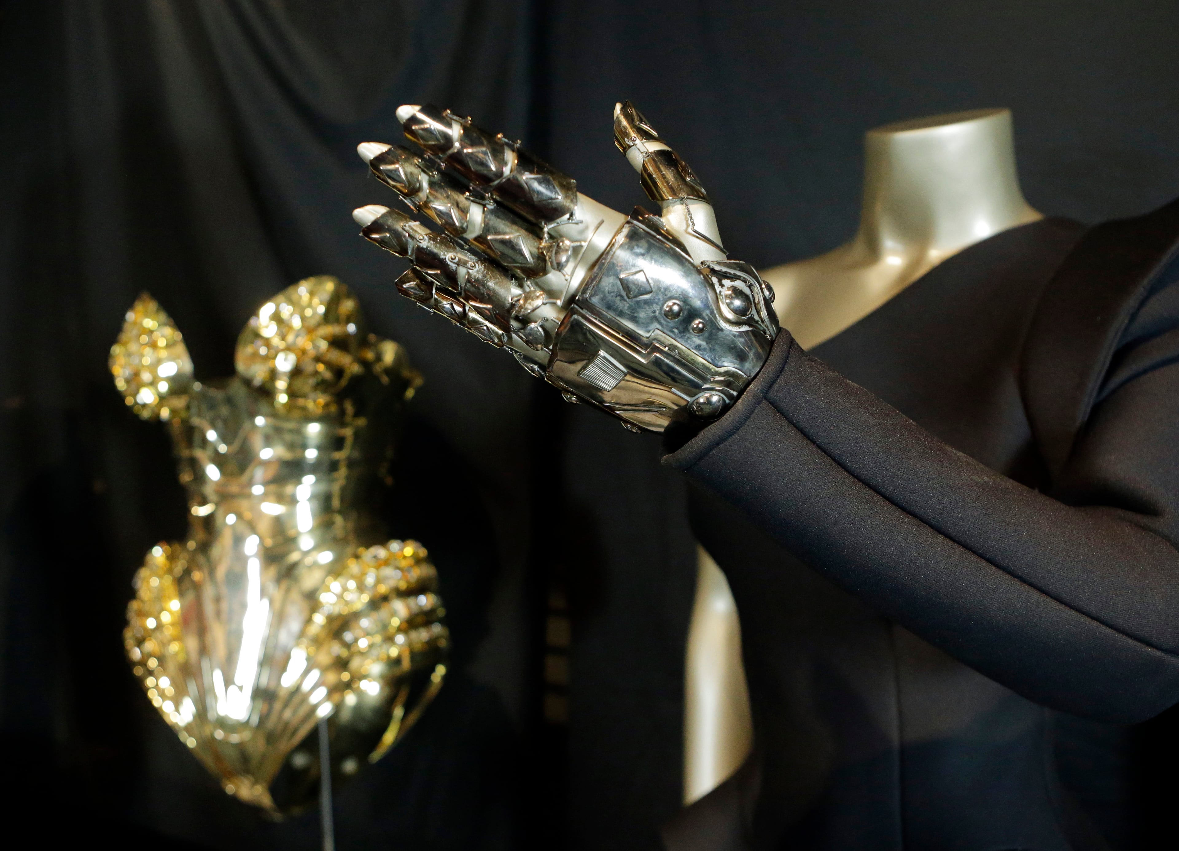 In this Thursday, July 17, 2014 photo, the glove from Beyonce's "Single Ladies" outfit is displayed in a new exhibit at the Rock and Roll Hall of Fame in Cleveland. The Rock Hall announced Friday, July 18, 2014, that outfits from Beyonce's Super Bowl performance and music videos will debut Tuesday in the Ahmet Ertegun Main Exhibit Hall in its Legends of Rock section next to iconic pieces from Michael Jackson, David Bowie and Bruce Springsteen. (AP Photo/Mark Duncan)