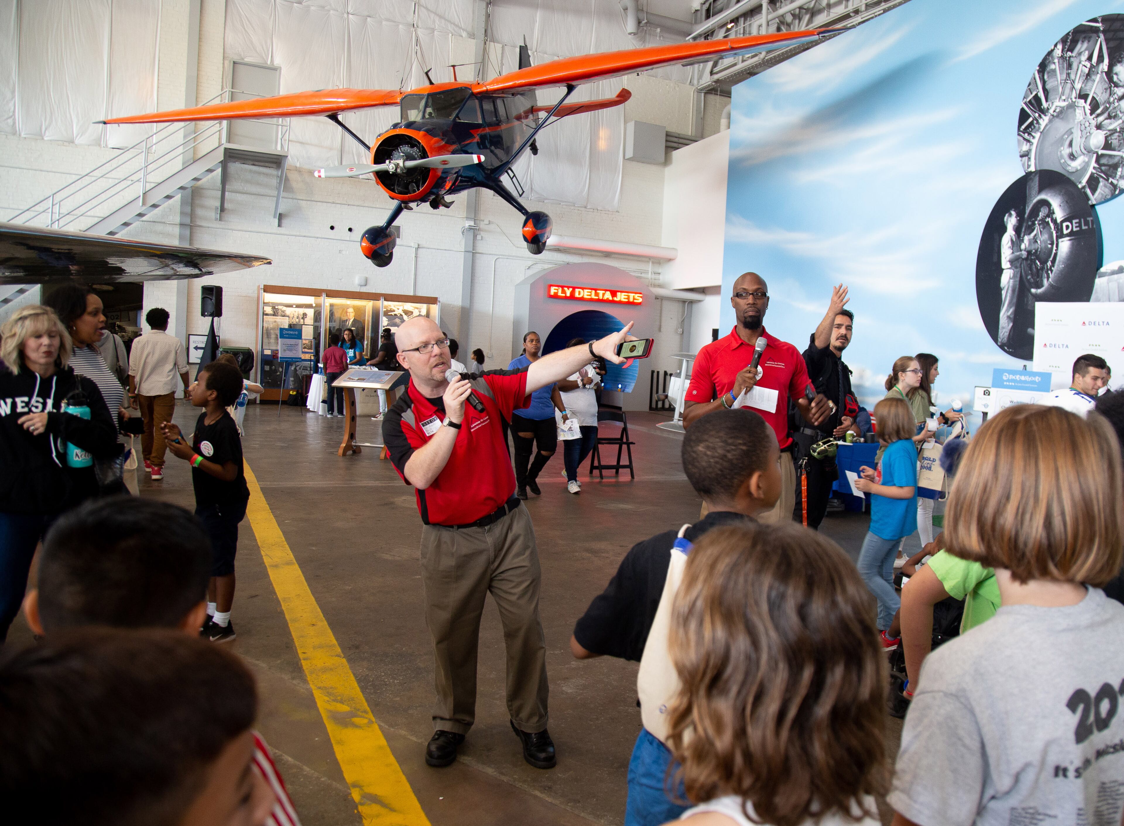Eric Powles gives directions to the participants during the Jane Goodall Institute's Roots & Shoots Celebration of Compassion, Action & Peace event at the Delta Flight Museum on Saturday, September 21, 2019. STEVE SCHAEFER / SPECIAL TO THE AJC