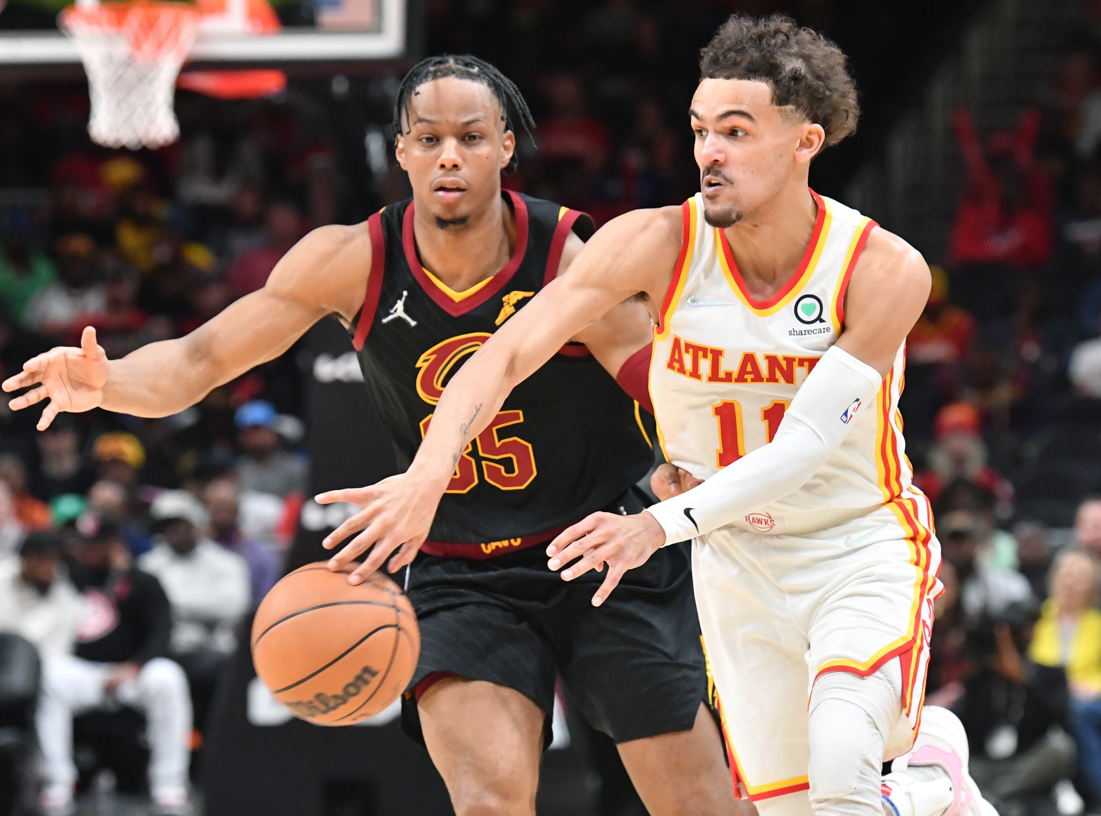 Hawks' guard Trae Young (11) gets off a pass during the first half in an NBA basketball game at State Farm Arena on Thursday, March 31, 2022. Atlanta Hawks won 131-107 over Cleveland Cavaliers. (Hyosub Shin / Hyosub.Shin@ajc.com)
