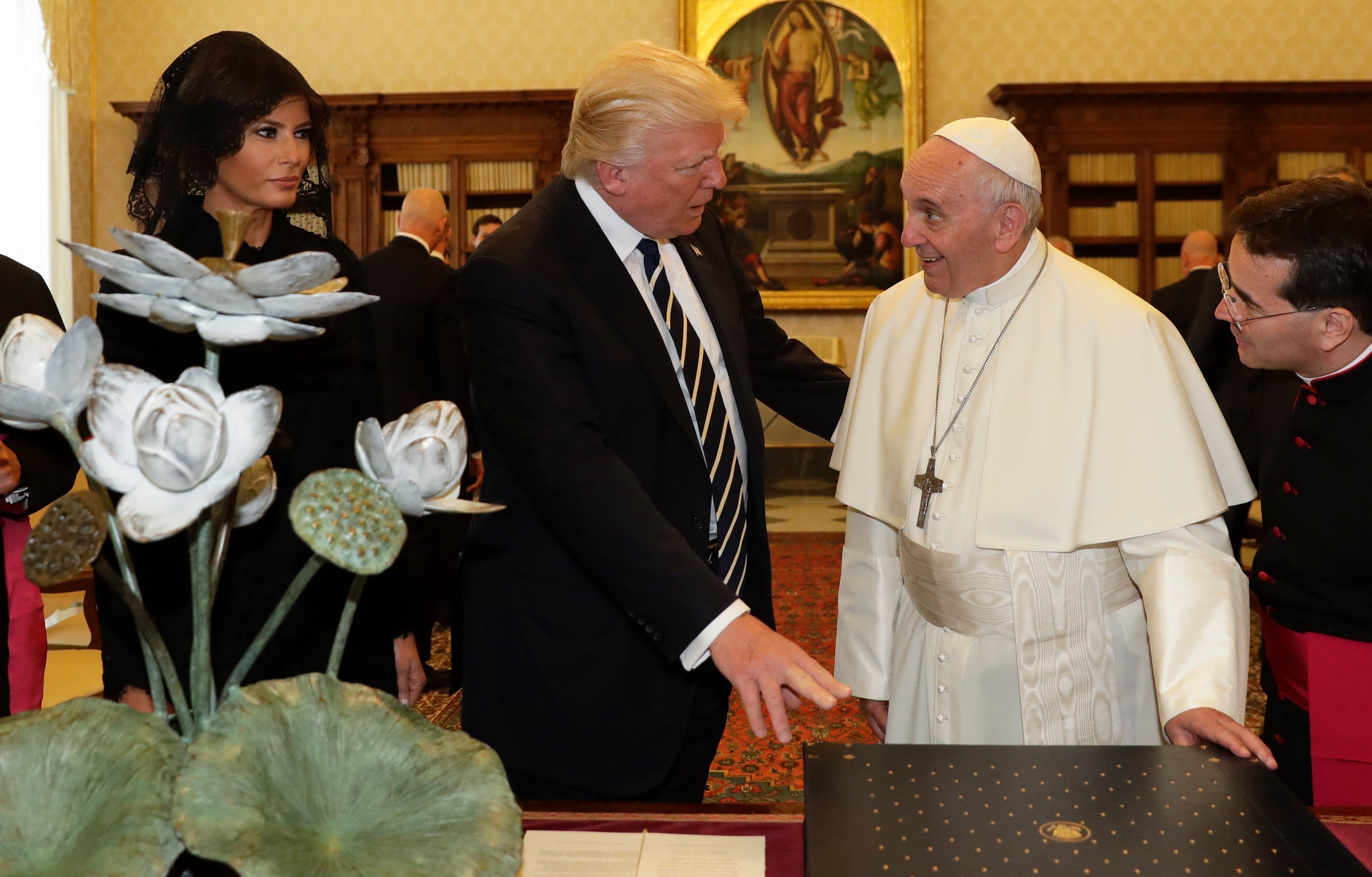 Pope Francis exchanges gifts with President Donald Trump and First Lady Melania Trump, on the occasion of their private audience, at the Vatican, Wednesday, May 24, 2017. (AP Photo/Alessandra Tarantino, Pool)
