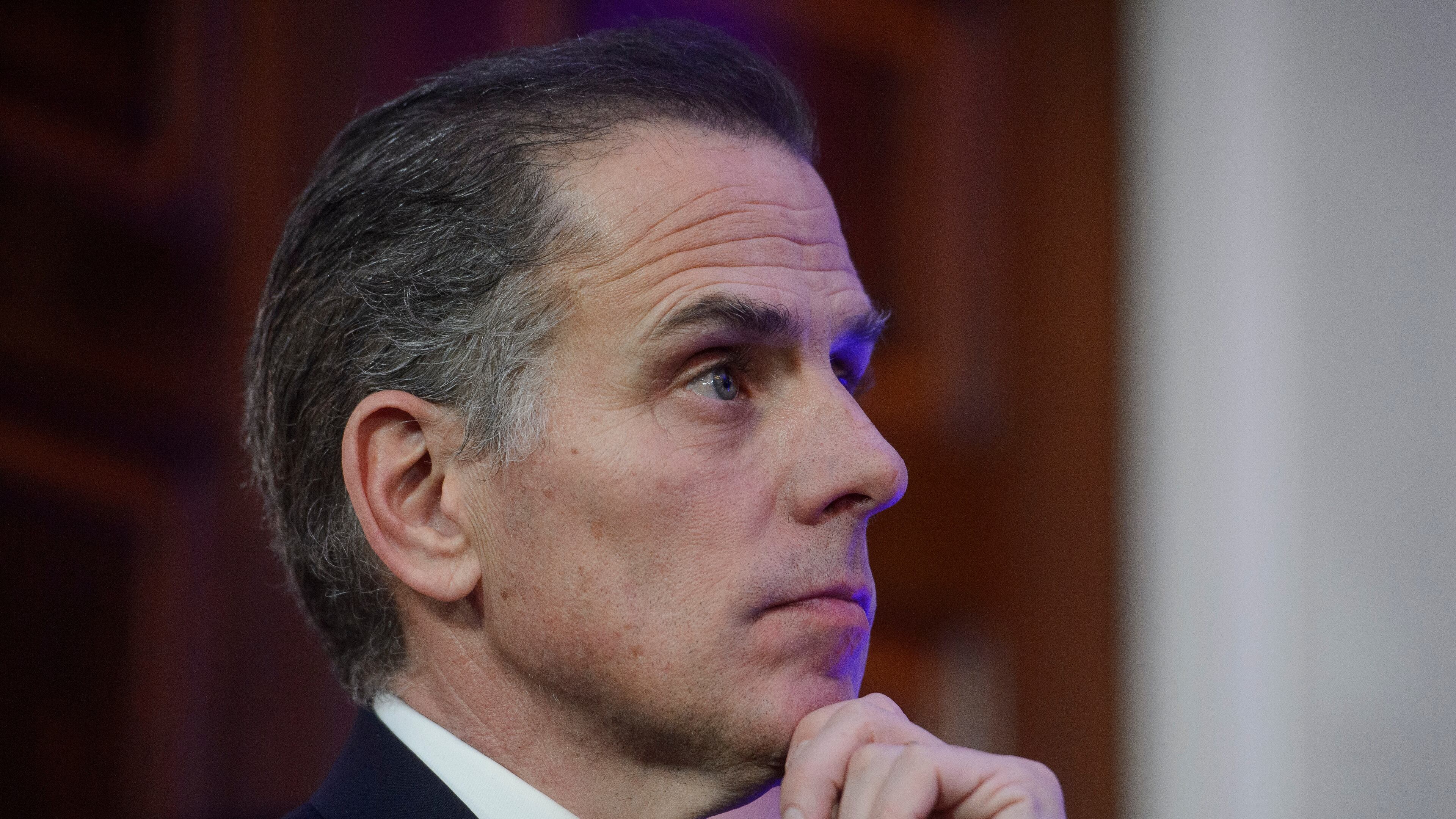 FILE - Hunter Biden listens while his father, President Joe Biden, speaks during a Hanukkah reception in the East Room of the White House in Washington, Dec. 16, 2024. (AP Photo/Rod Lamkey, Jr., File)