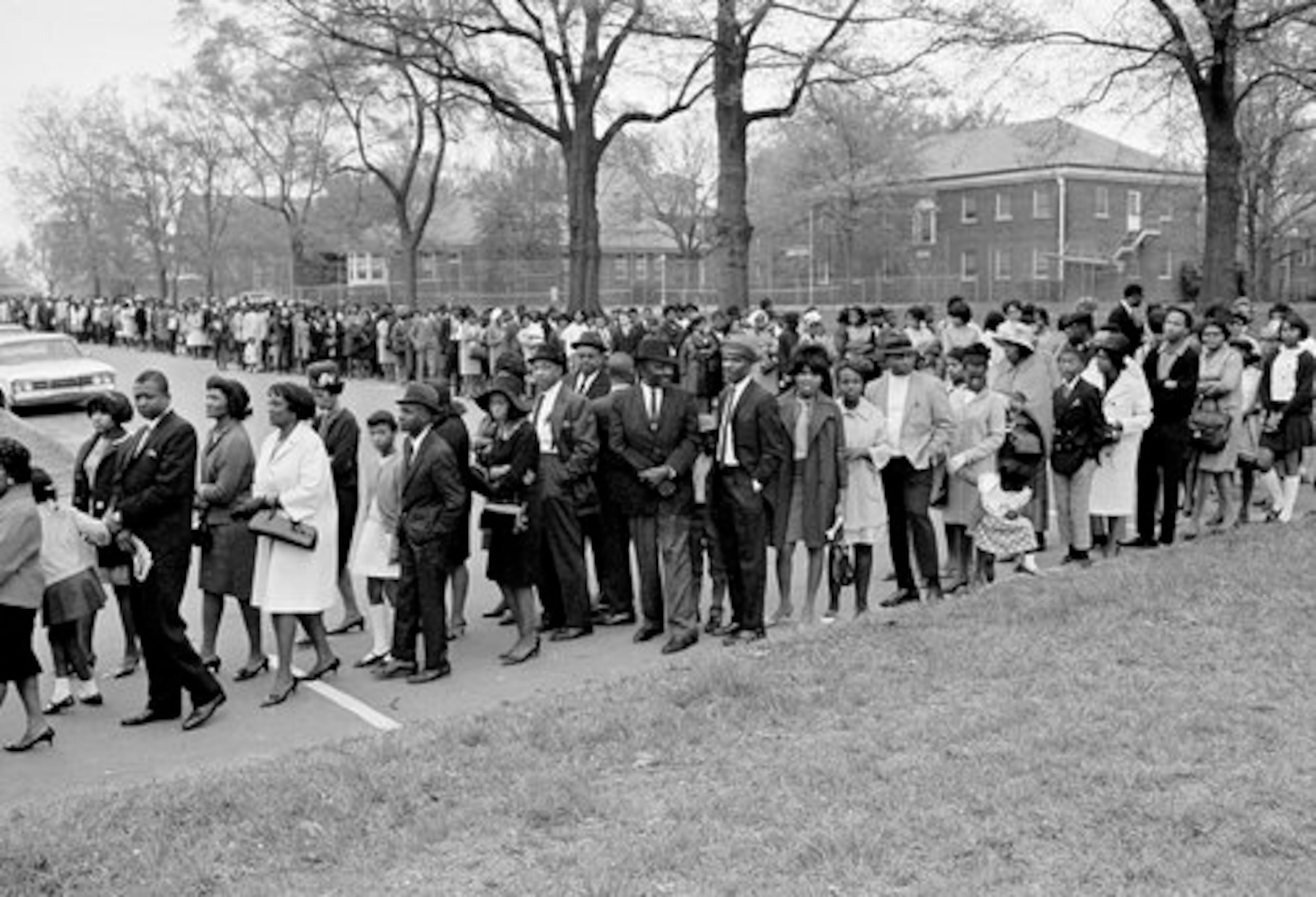 Thousands of mourners file into Sisters Chapel at Spelman College in Atlanta to pay final respects to slain civil rights leader Dr. Martin Luther King, Jr., lying in state, April 8, 1968. Funeral services will be conducted Tuesday.