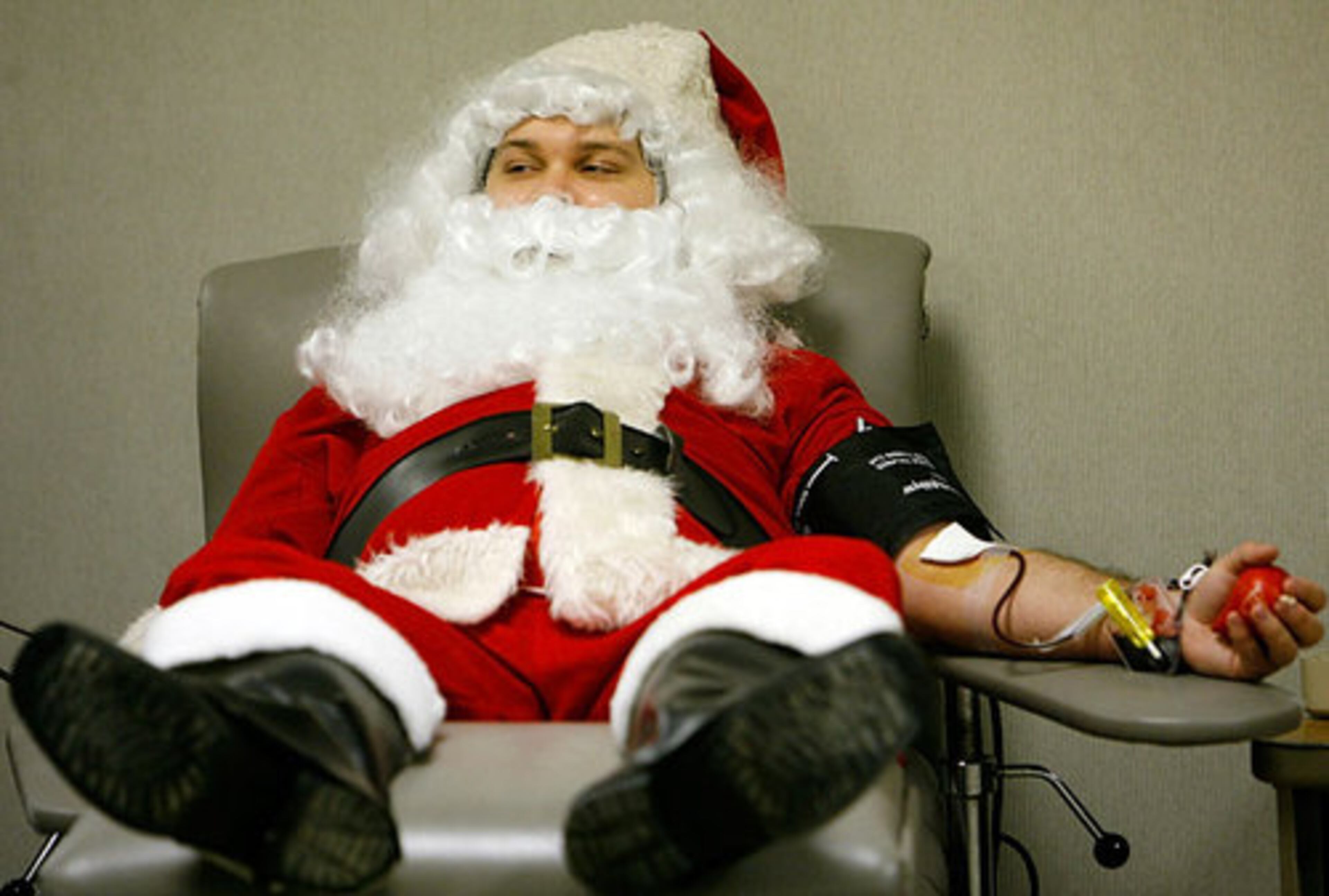 Santa helps his fellow man by giving blood at the American Red Cross in Tulsa, Okla.