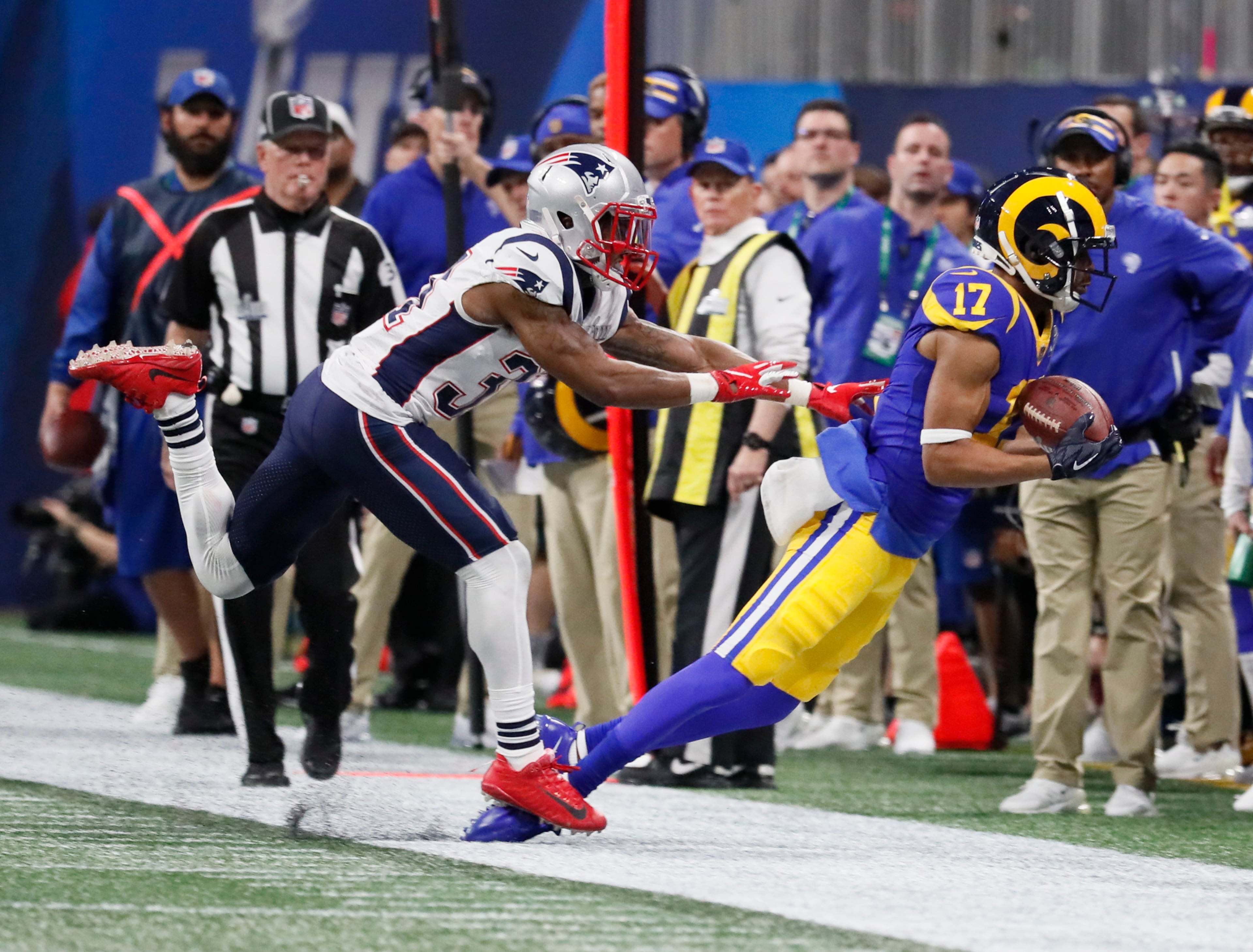 2/3/19 - Atlanta - New England Patriots defensive back Jonathan Jones (31) and Los Angeles Rams wide receiver Robert Woods (17) right along the sidelines in the second quarter during Super Bowl LIII on Sunday, Feb. 3, 2019 at Mercedes-Benz Stadium in Atlanta, Ga. Bob Andres / bandres@ajc.com