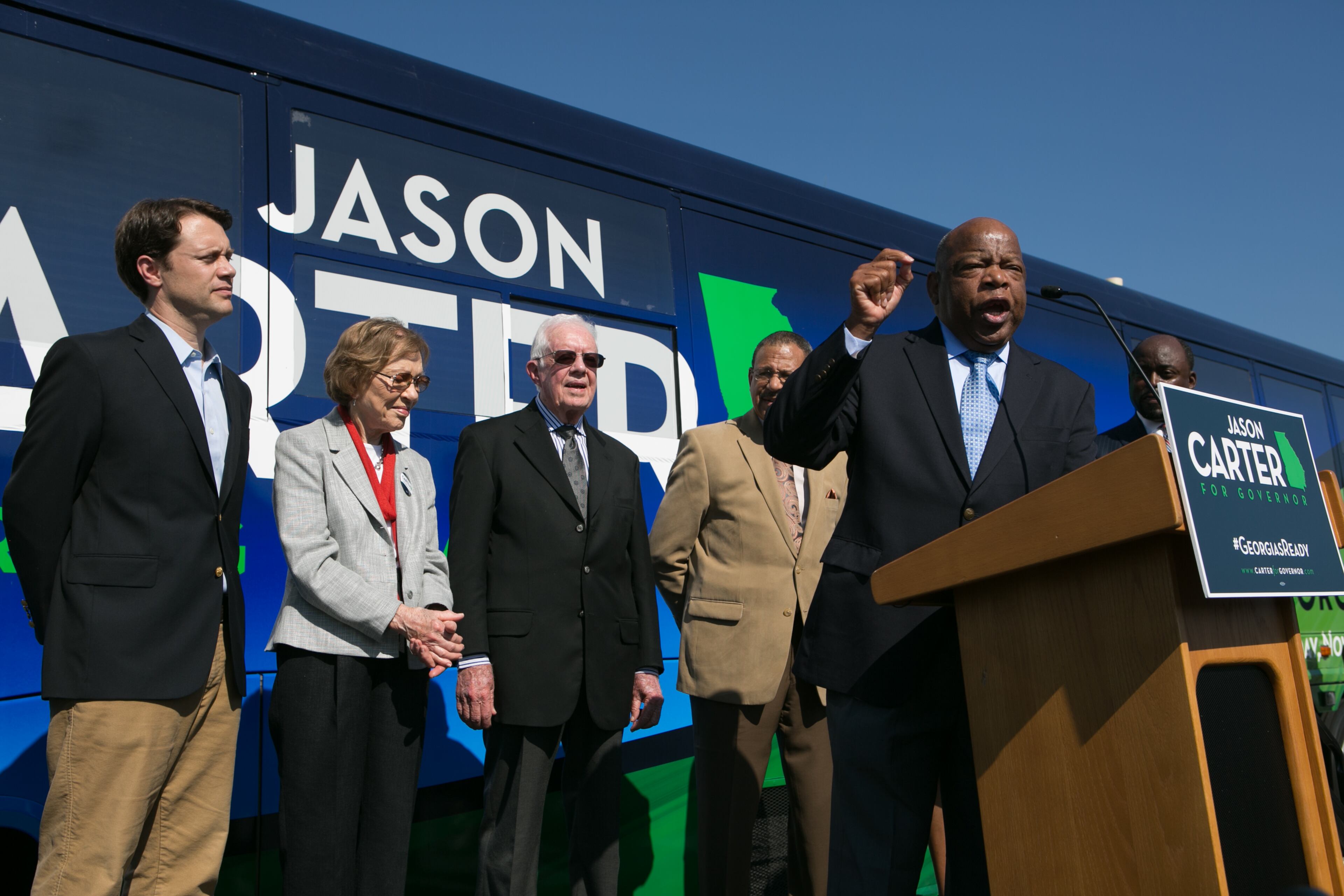 U.S. Rep. John Lewis (D-GA) (R) speaks while campaigning for Georgia Democratic gubernatorial candidate and State Sen. Jason Carter (L) as his grandparents, former first lady Rosalynn Carter and former U.S. President Jimmy Carter, look on at Emmanuel Christian Community Church on October 27, 2014 in Columbus, Georgia. Jason Carter is running against the Republican incumbent Georgia Republican Gov. Nathan Deal. (Photo by Jessica McGowan/Getty Images)