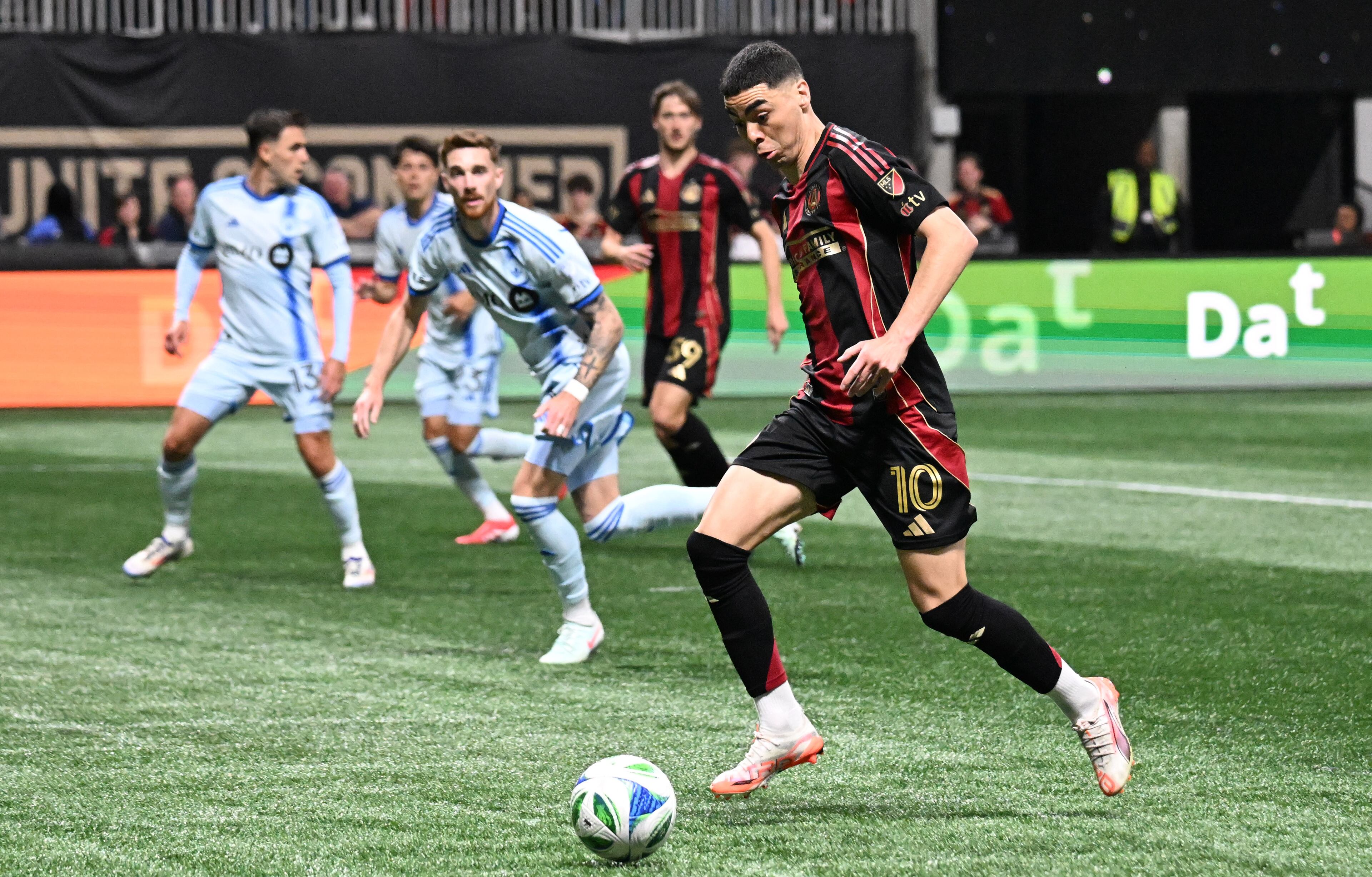 Atlanta United forward Emmanuel Latte Lath (19) works with the ball during the first half of Atlanta United’s MLS season opener at Mercedes-Benz Stadium, Saturday, February 22, 2025, in Atlanta. (Hyosub Shin / AJC)