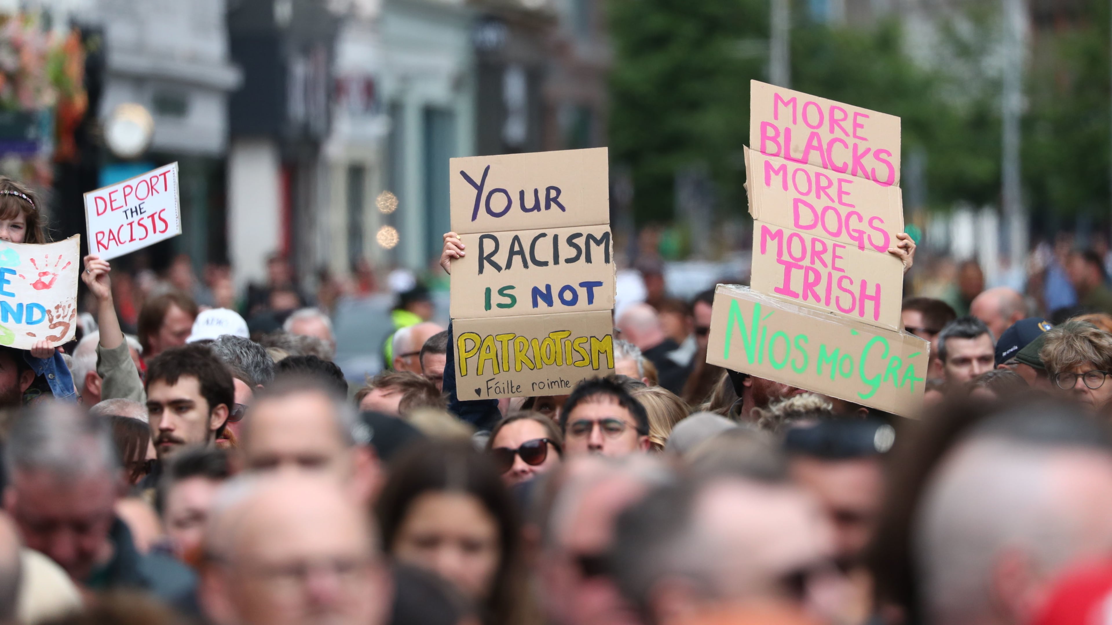 People gather during an anti-racism rally outside Belfast City Hall sparked by a knife attack on a man in north Belfast on Monday, in Belfast, Saturday June 13, 2026. (Peter Morrison/PA via AP)