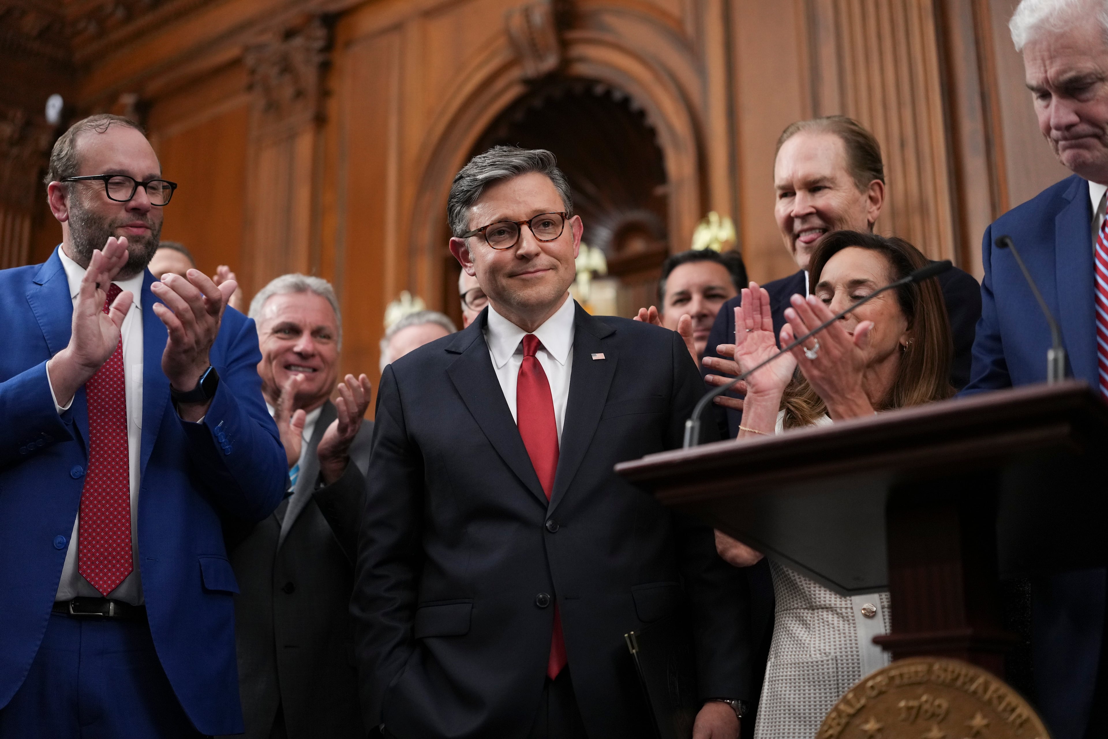 House Speaker Mike Johnson (center), R-La., stands as people applaud after the House passed President Donald Trump’s domestic policy bill at the Capitol on Thursday, July 3, 2025, in Washington D.C. Experts warned that universities would need more time to implement the One Big Beautiful Bill Act’s changes to student loan policy. (Eric Lee/The New York Times)
