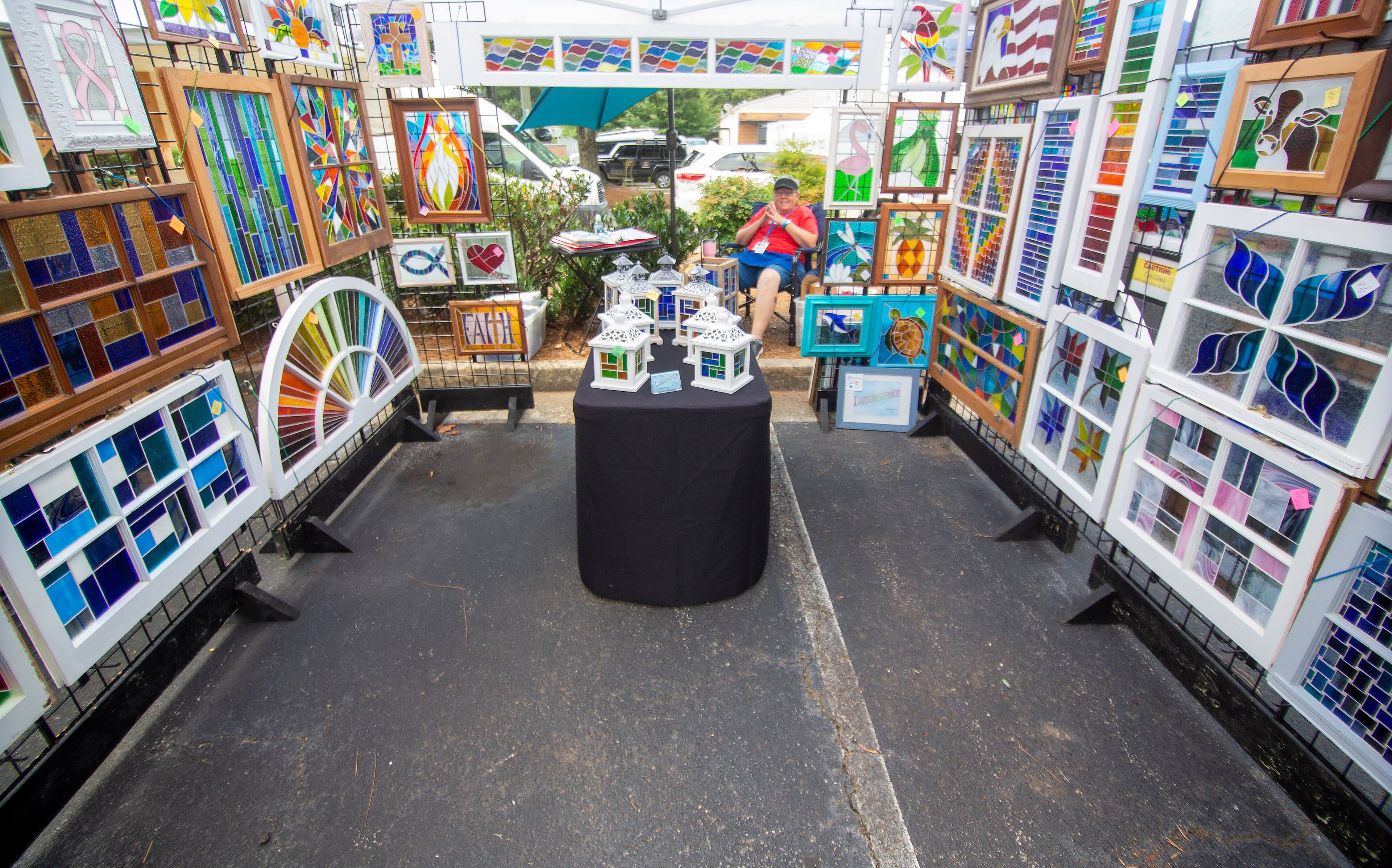 Bev Eaton waits for customers in her artist tent during the Roswell Spring Arts and Crafts Festival on Sunday, June 13, 2021. (Photo: Steve Schaefer for The Atlanta Journal-Constitution)